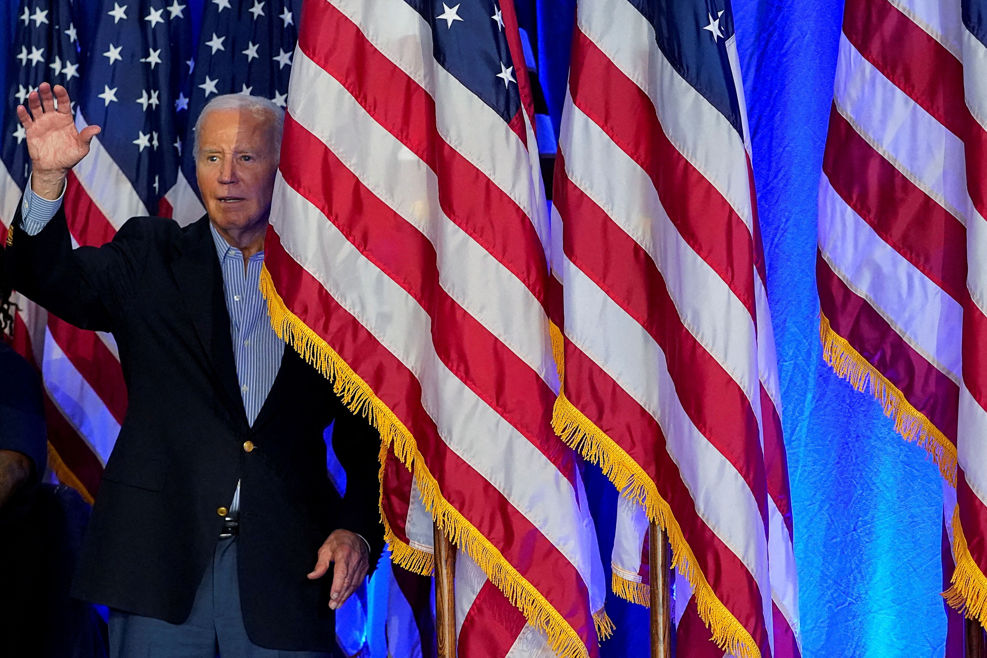 President Biden arrives onstage at a rally in Madison, Wis., on Friday.