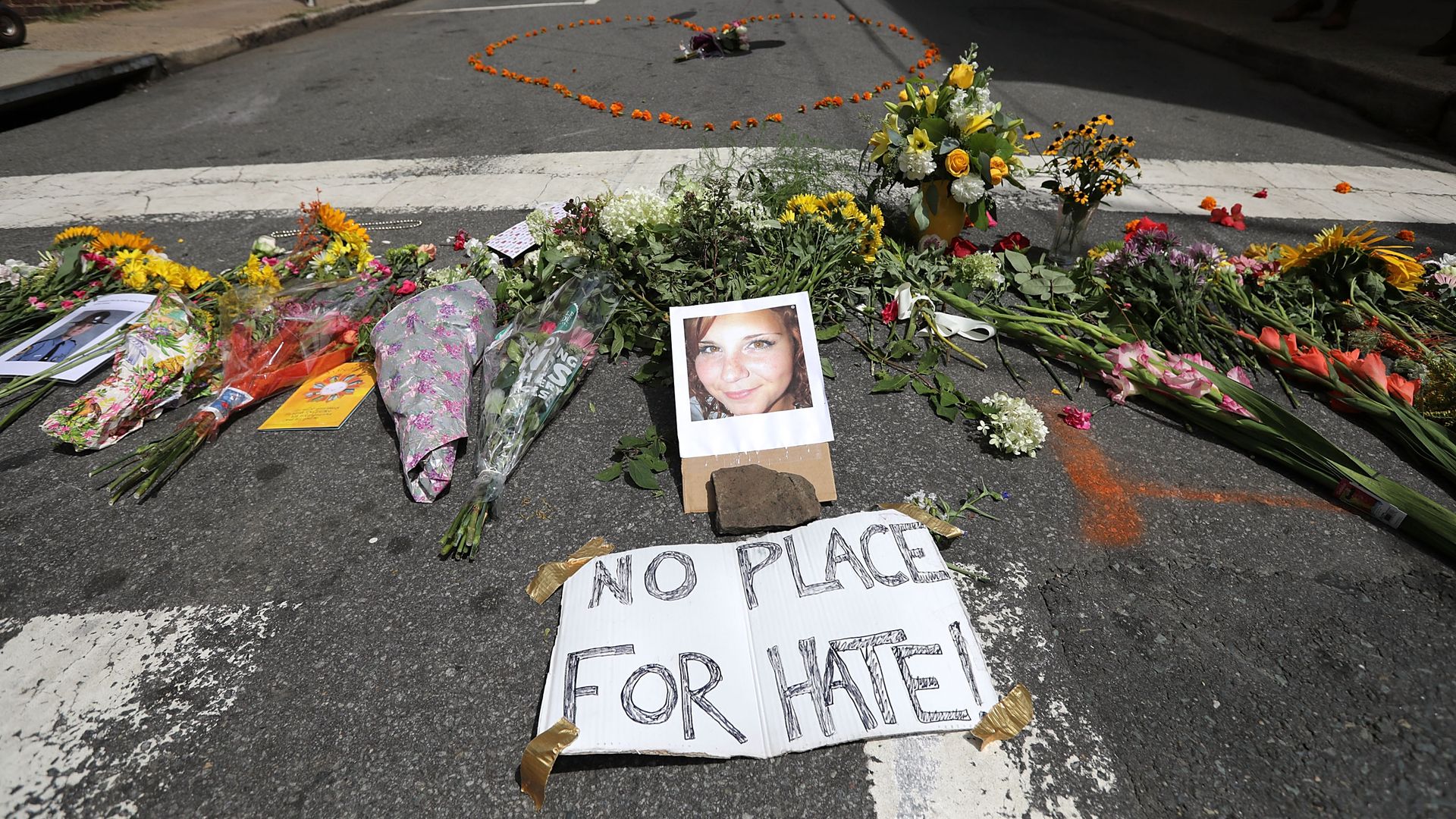A memorial on the street to Heather Heyer, with a sign that reads: "No place for hate." 
