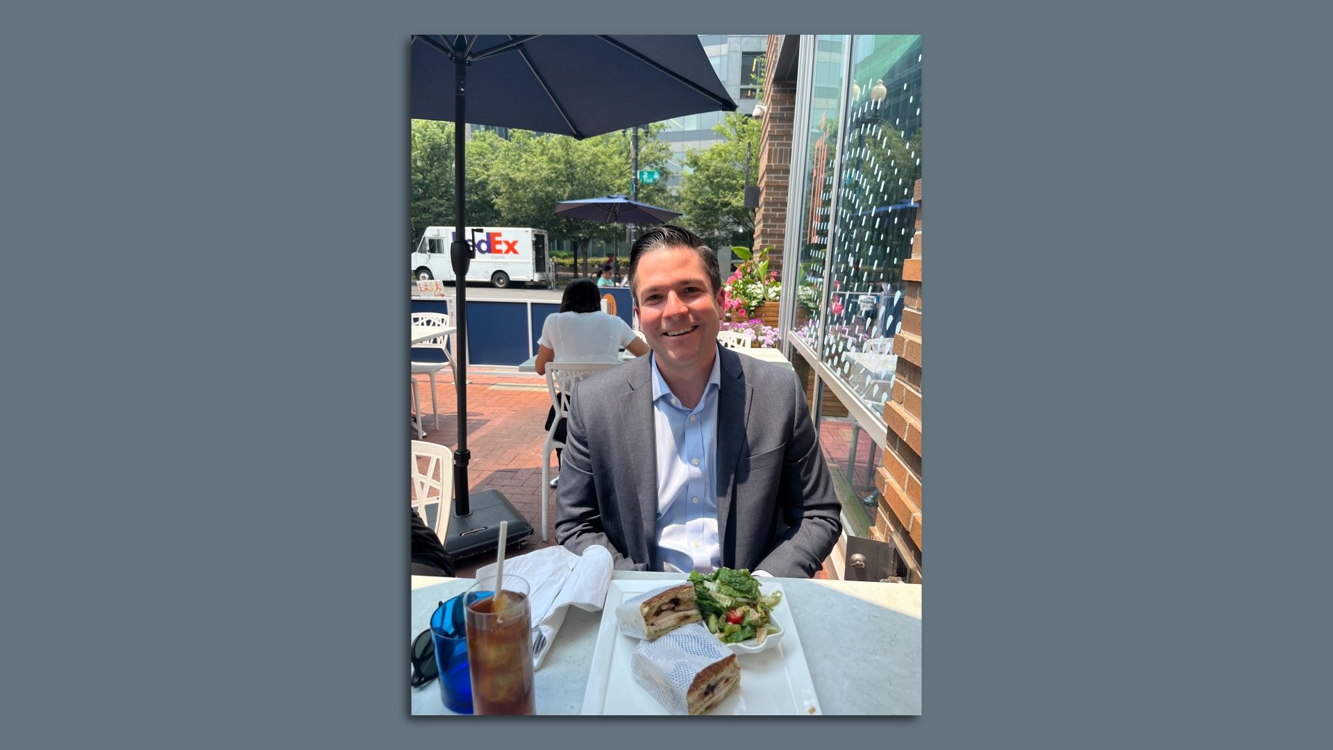 Microsoft's Gerry Petrella eats lunch at an outdoor cafe