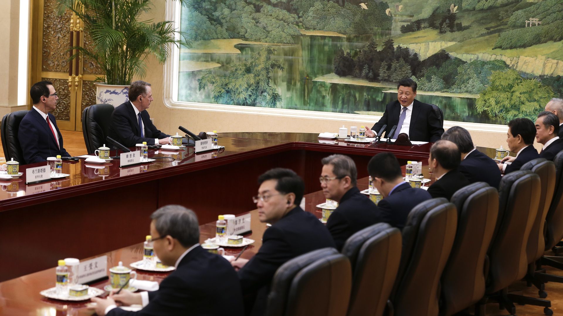 In this image, Chinese President Xi Jinping speaks at a trade summit along with U.S. representatives.