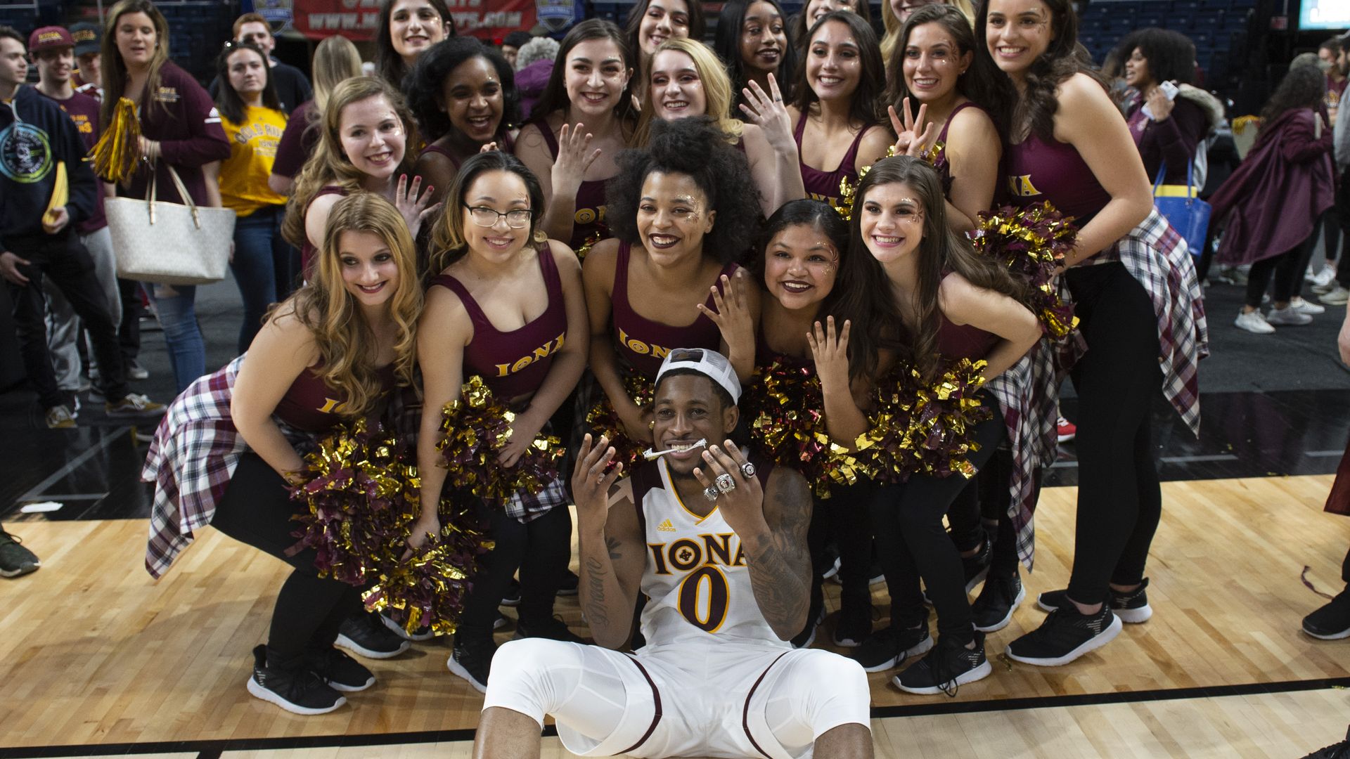Iona player and cheerleaders celebrating