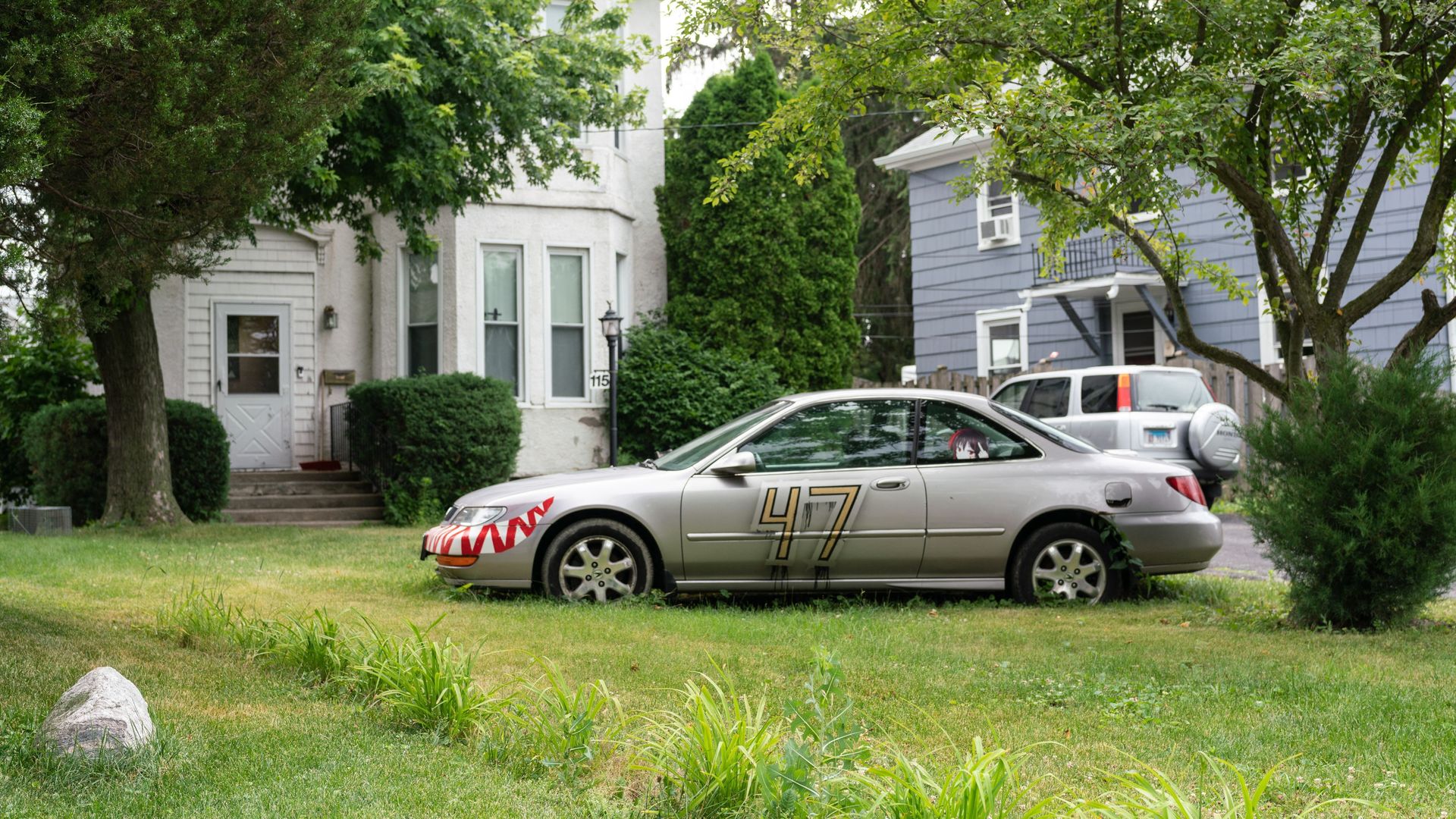 Silver car on a lawn 