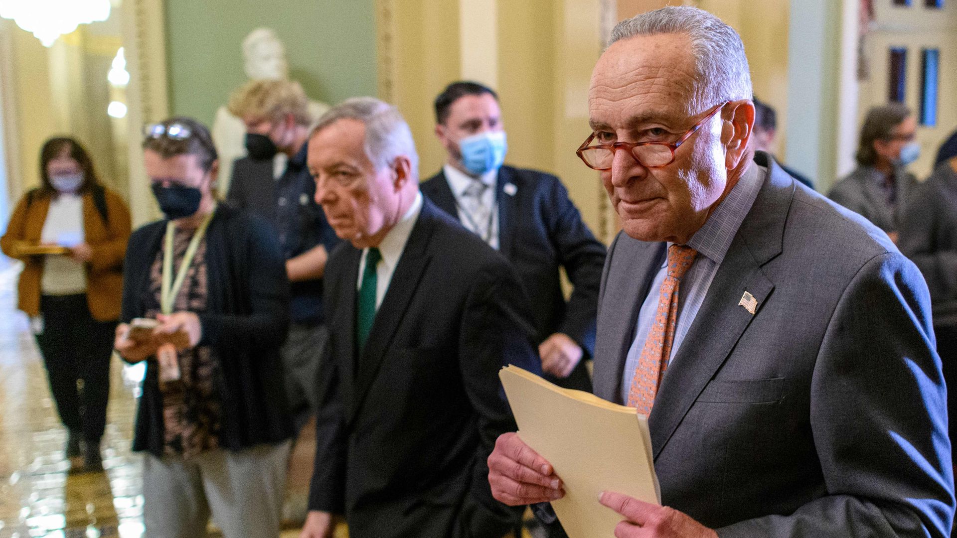 Senate Majority Leader Chuck Schumer (D- New York) and Majority Whip Dick Durbin (D-Illinois), head to the Senate Chamber after speaking to reporters at the US Capitol