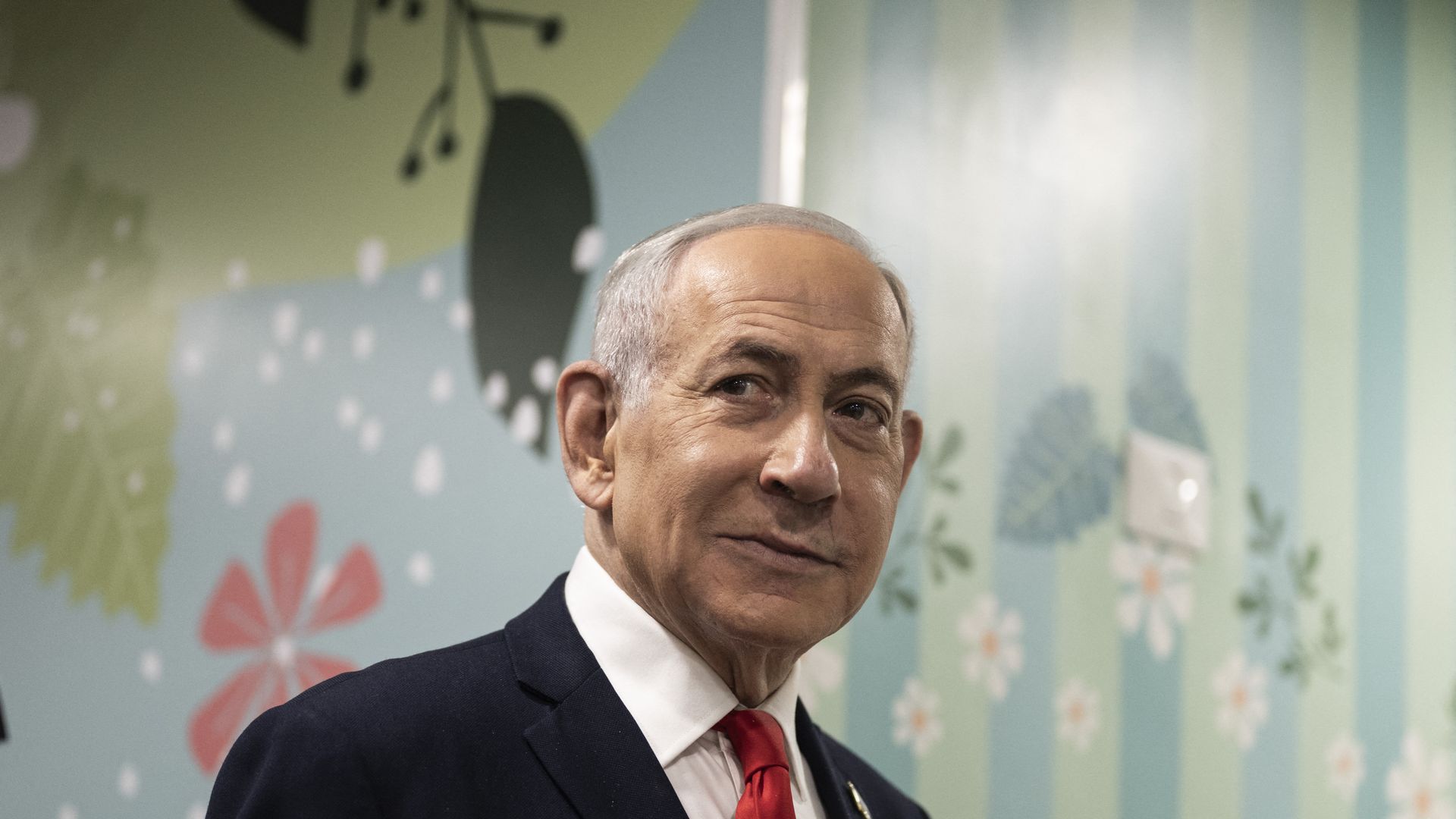 Israeli Prime Minister Benjamin Netanyahu arrives to speak to the media after voting at a polling station in Jerusalem on Tuesday.