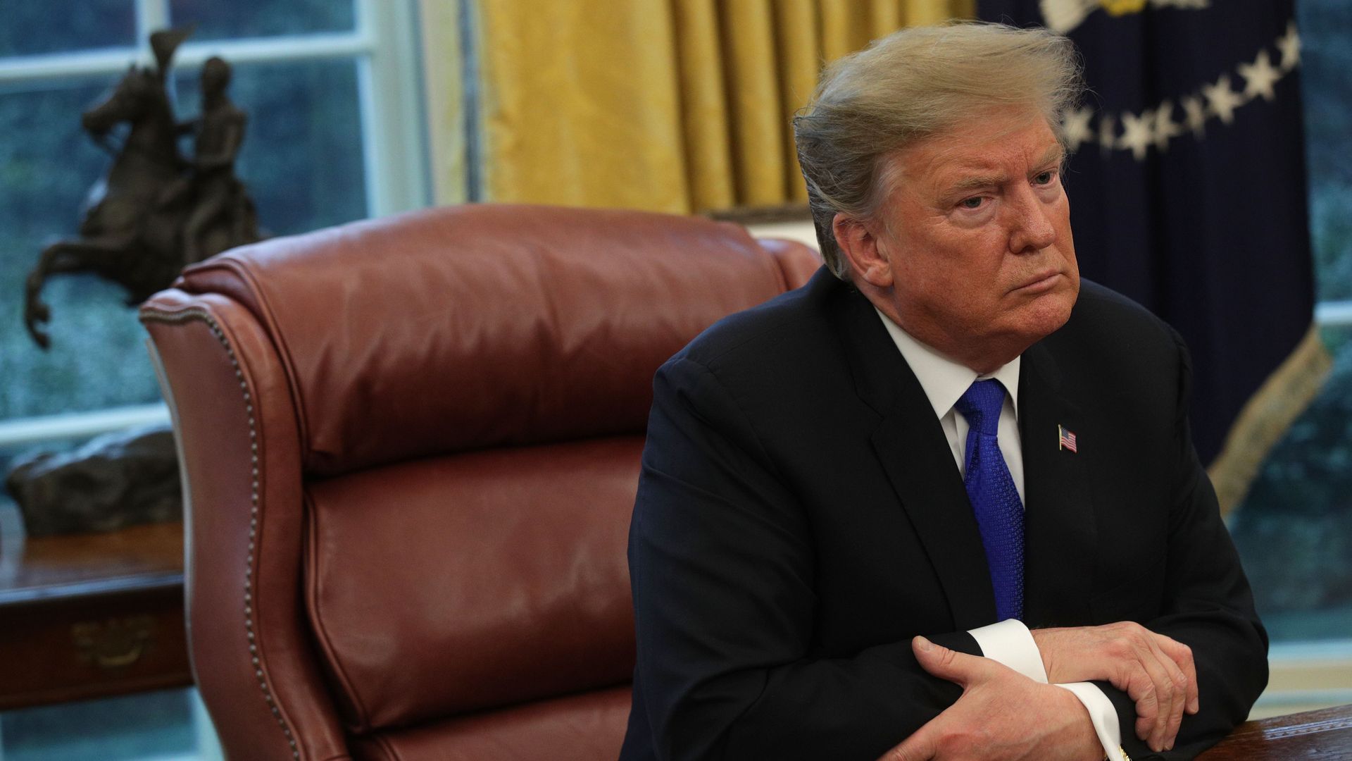 Donald Trump looks stern.