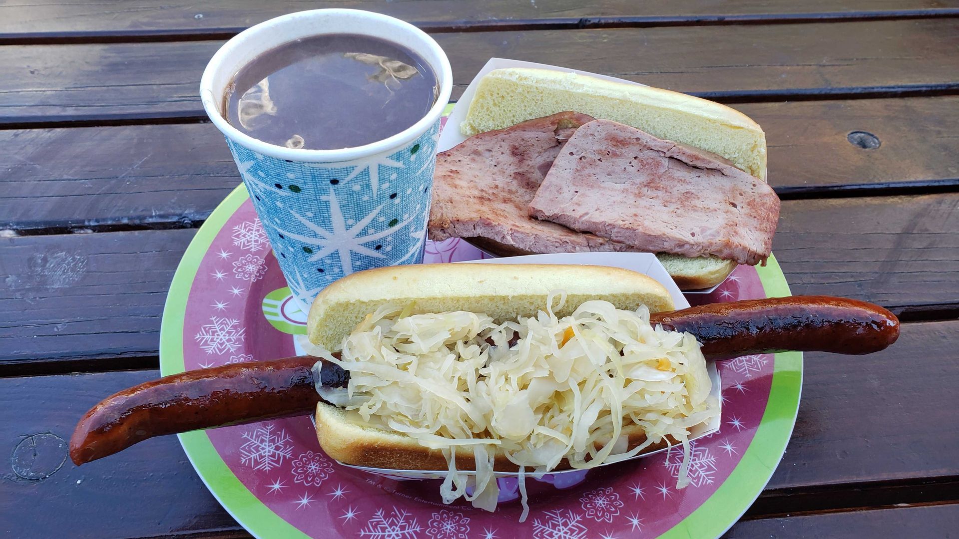 Plate with sausage and hot cocoa. 