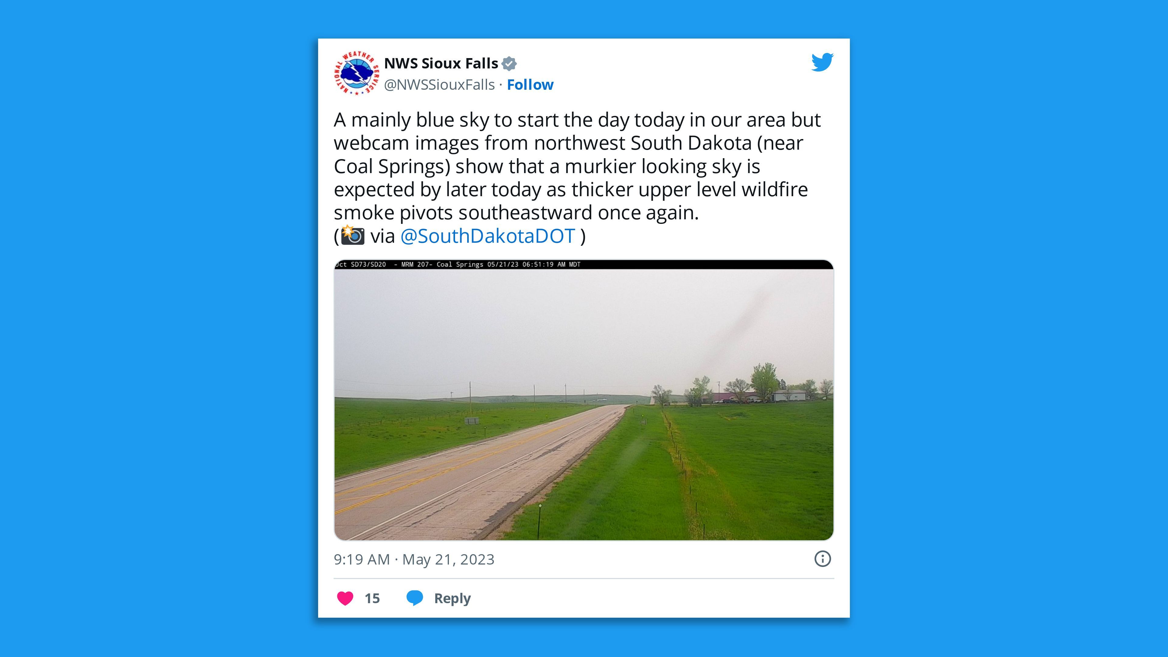 A screenshot of an NWS Sioux Falls tweet of a smoky sky saying: "A mainly blue sky to start the day today in our area but webcam images from northwest South Dakota (near Coal Springs) show that a murkier looking sky is expected by later today as thicker upper level wildfire smoke pivots southeastward once again."