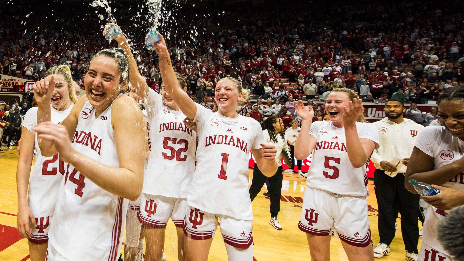 The IU women's basketball team celebrates after Mackenzie Holmes made history as the program's all-time leading scorer in a Feb. 11 win over the Boilermakers. Photo: Jeremy Hogan/Getty Images