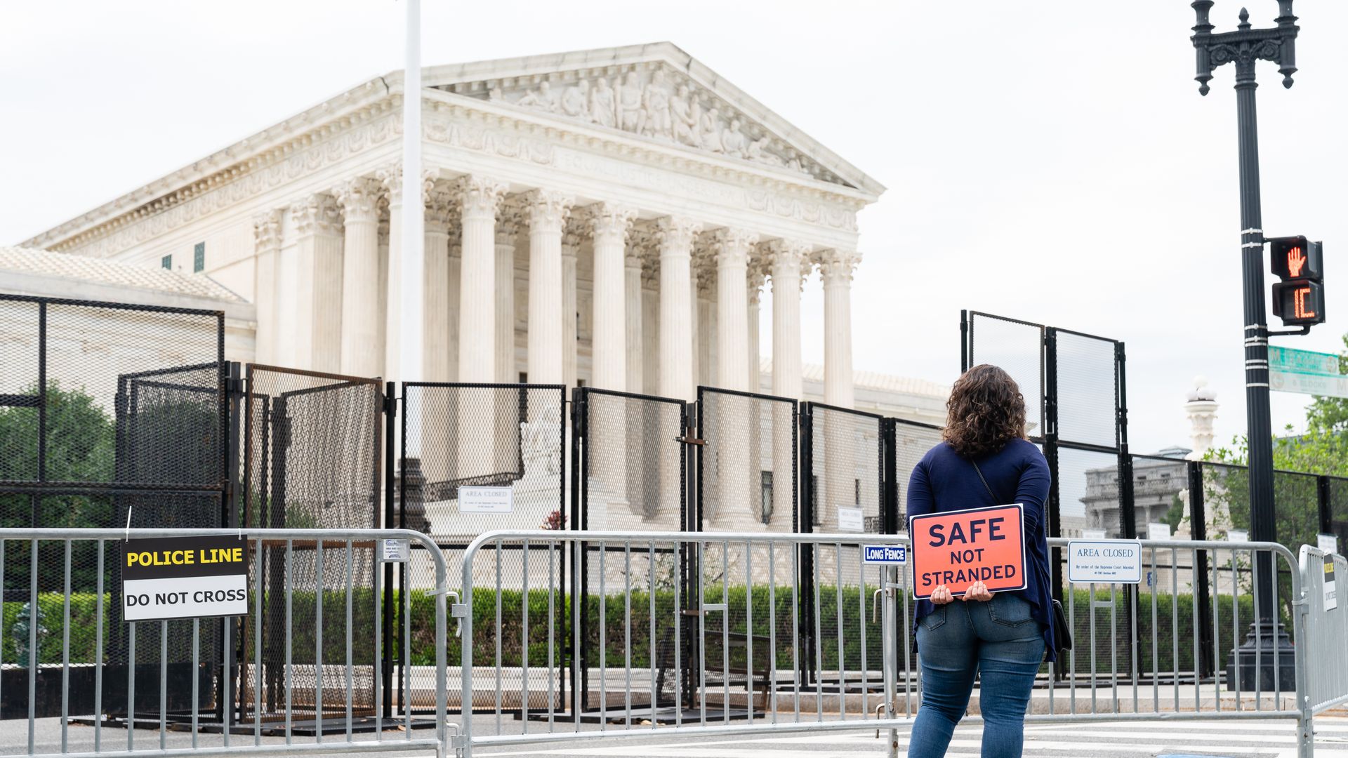 A Remain in Mexico protester in front of the Supreme Court