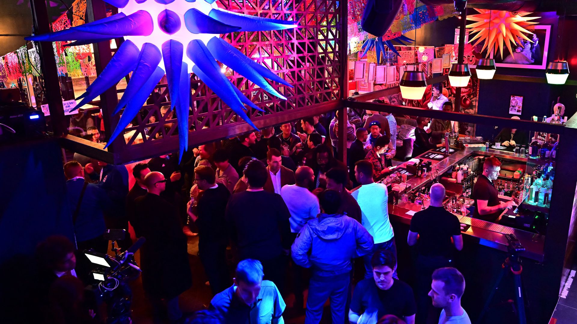 Patrons crowd Beaux Bar in San Francisco's Castro District. 