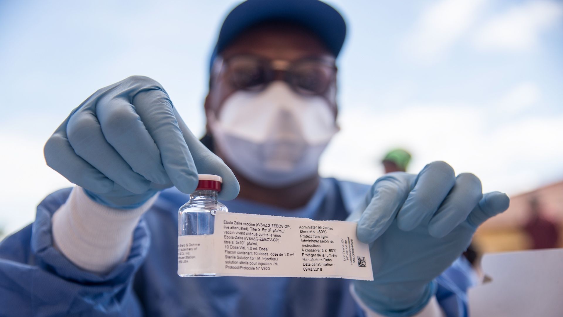 Health care worker in the DRC holds a vial of the experimental Ebola virus vaccine.