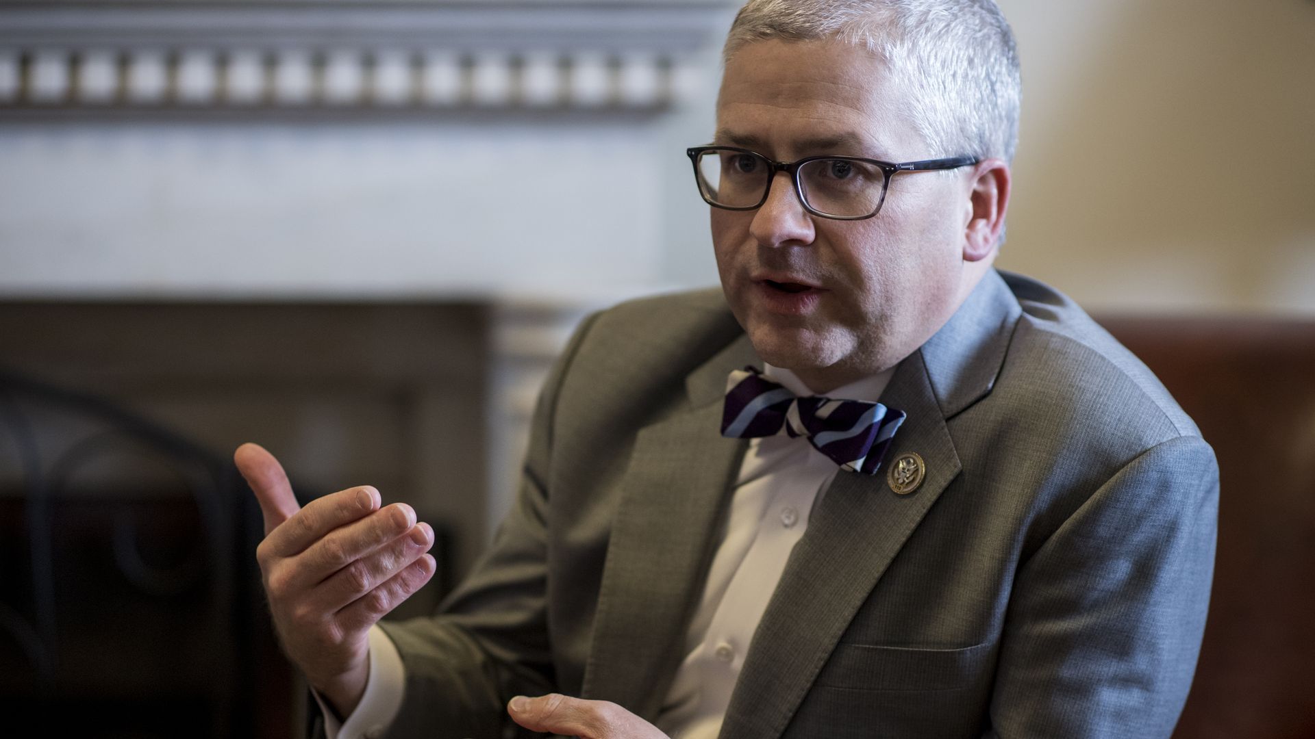 GOP Rep. Patrick McHenry sitting in a chair.