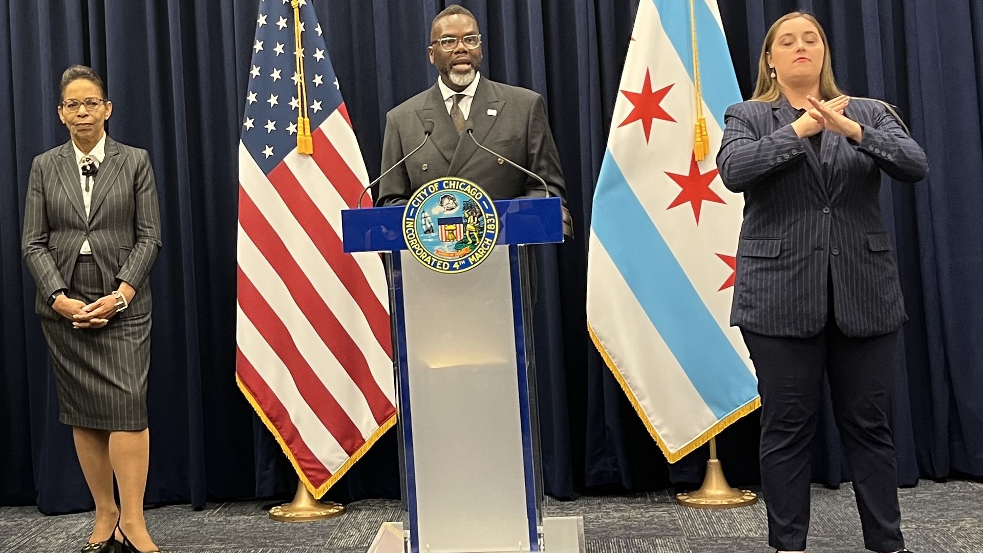 people in front of a flag