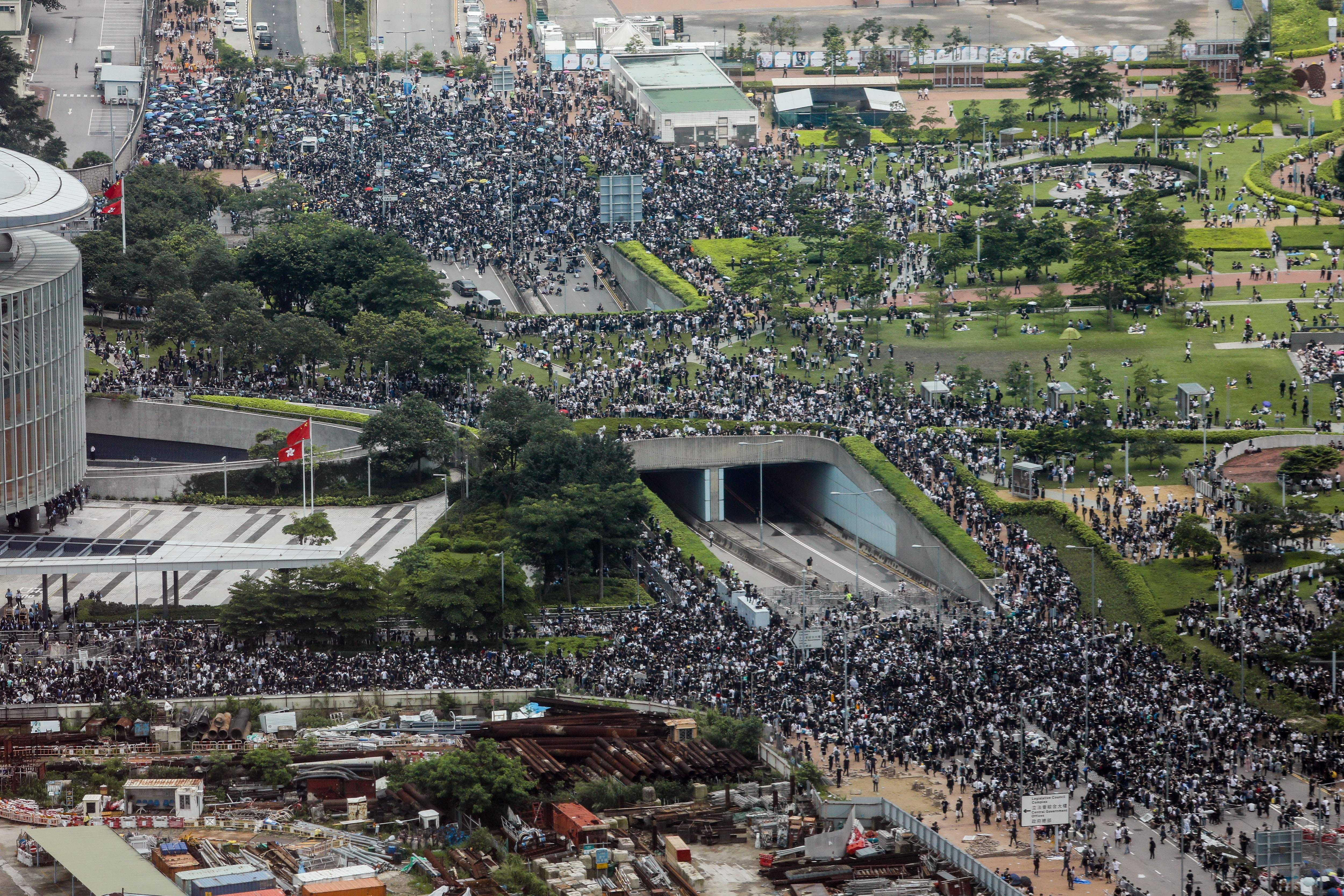 Protesters block roads during a rally outside the government headquarters in Hong Kong on June 12, 2019.