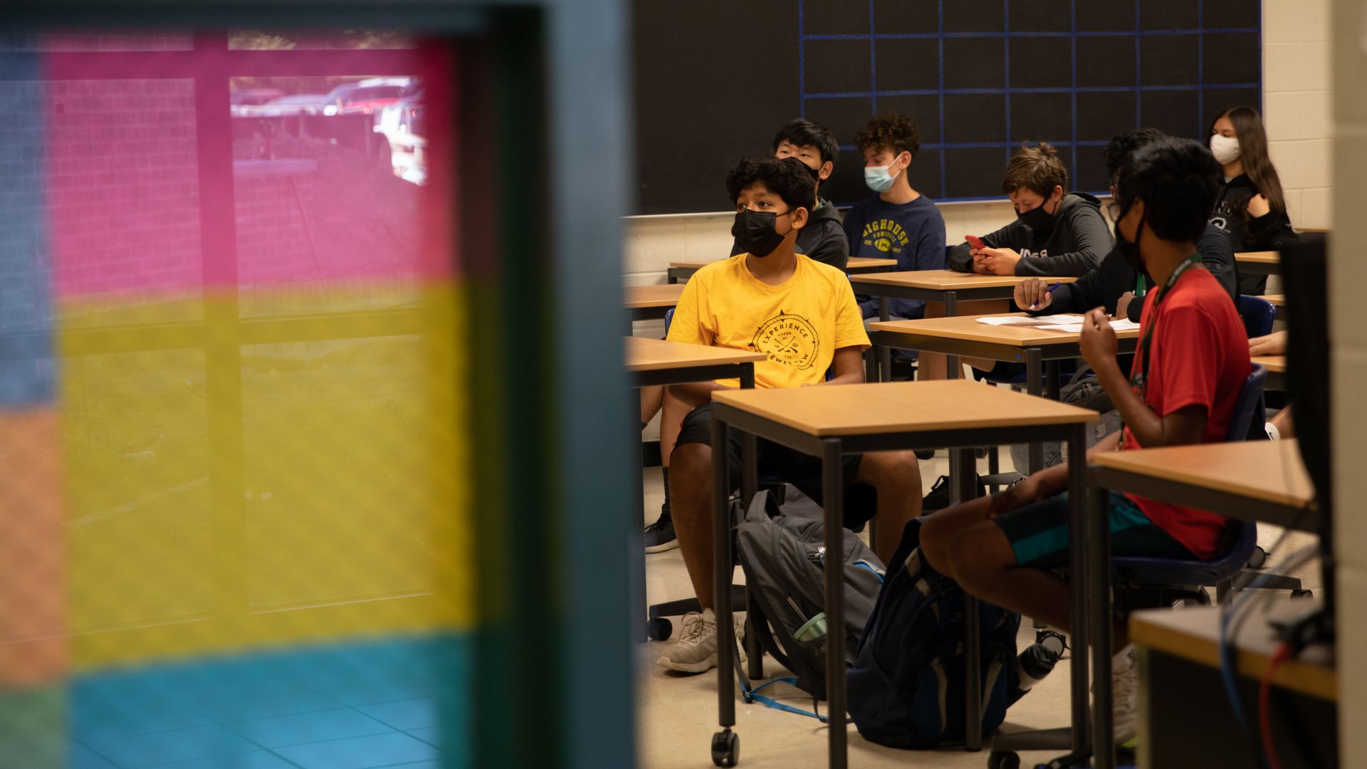 Students sit in a classroom at a high school during the first day of classes in Novi, Michigan, U.S
