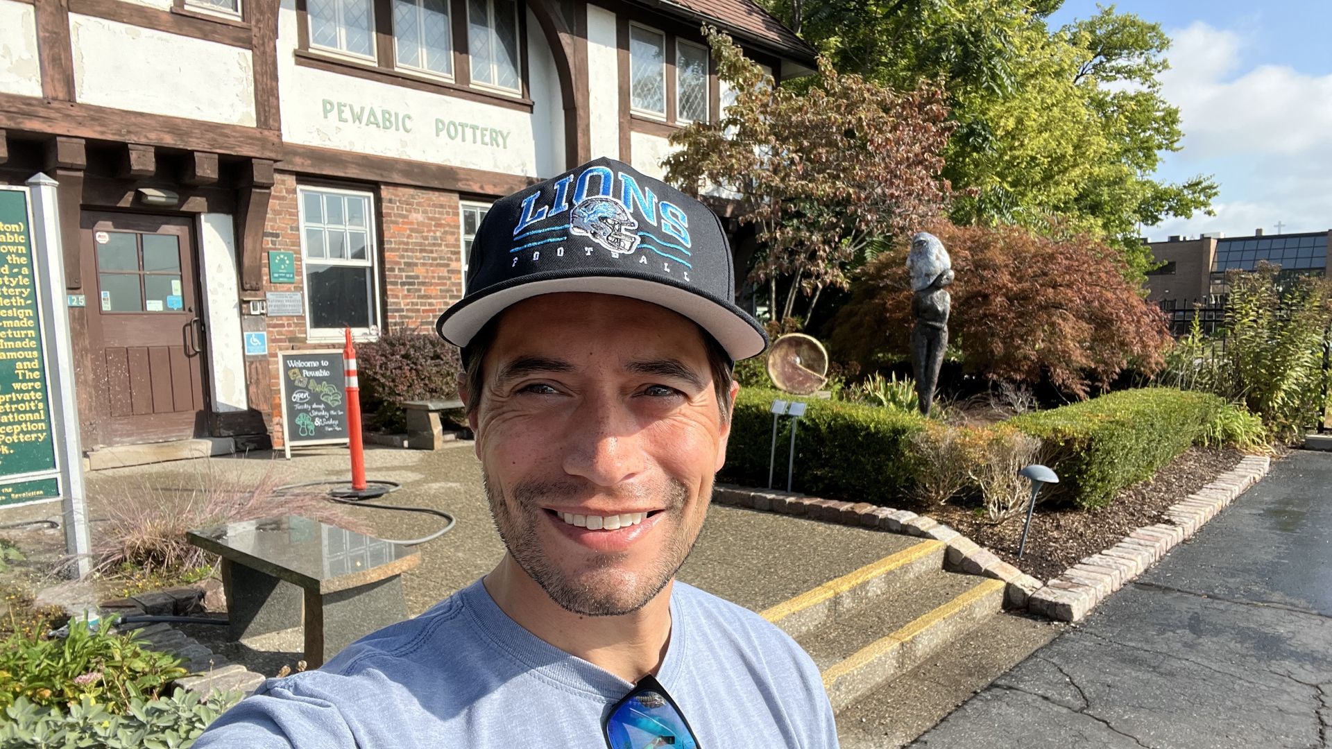 Joe with Pewabic Pottery's building in the background. You can see the sign that says the name!