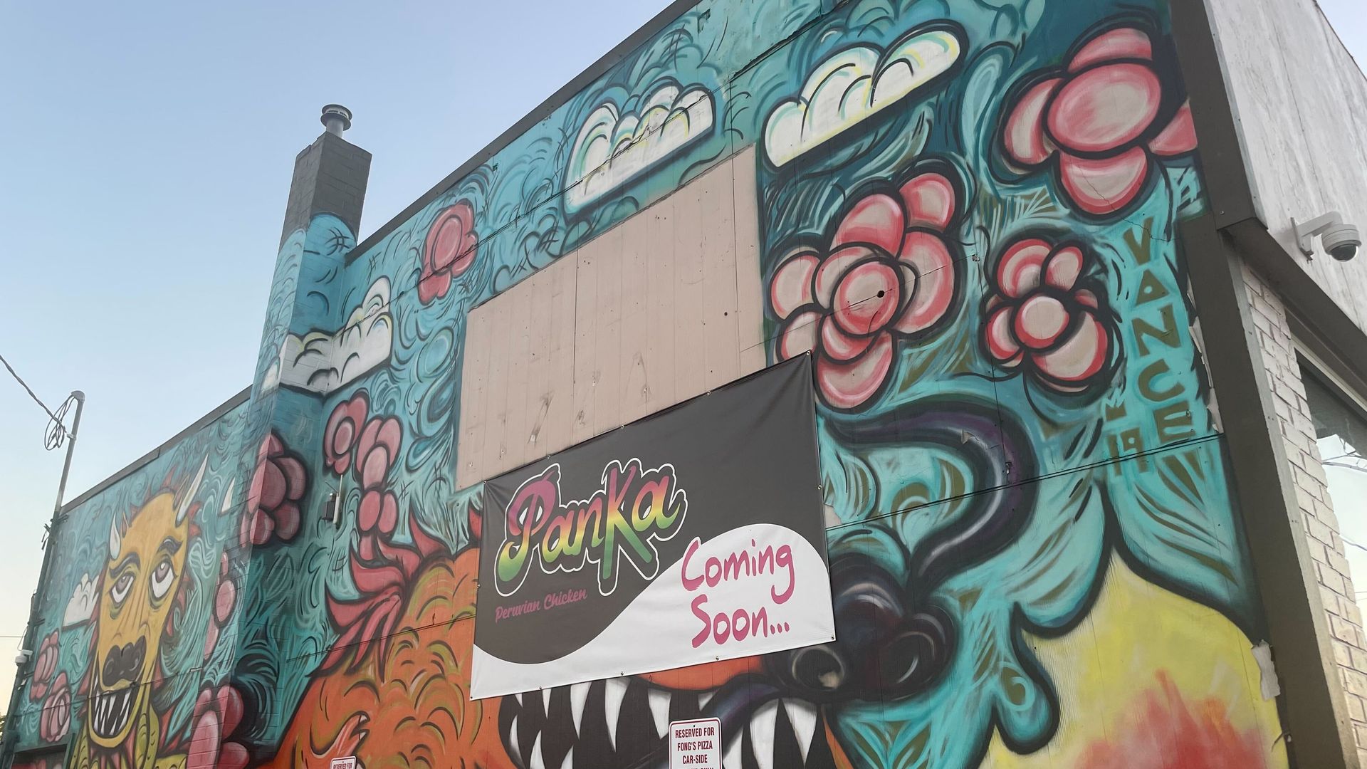 Mural with sign of "Panka: coming soon" on it