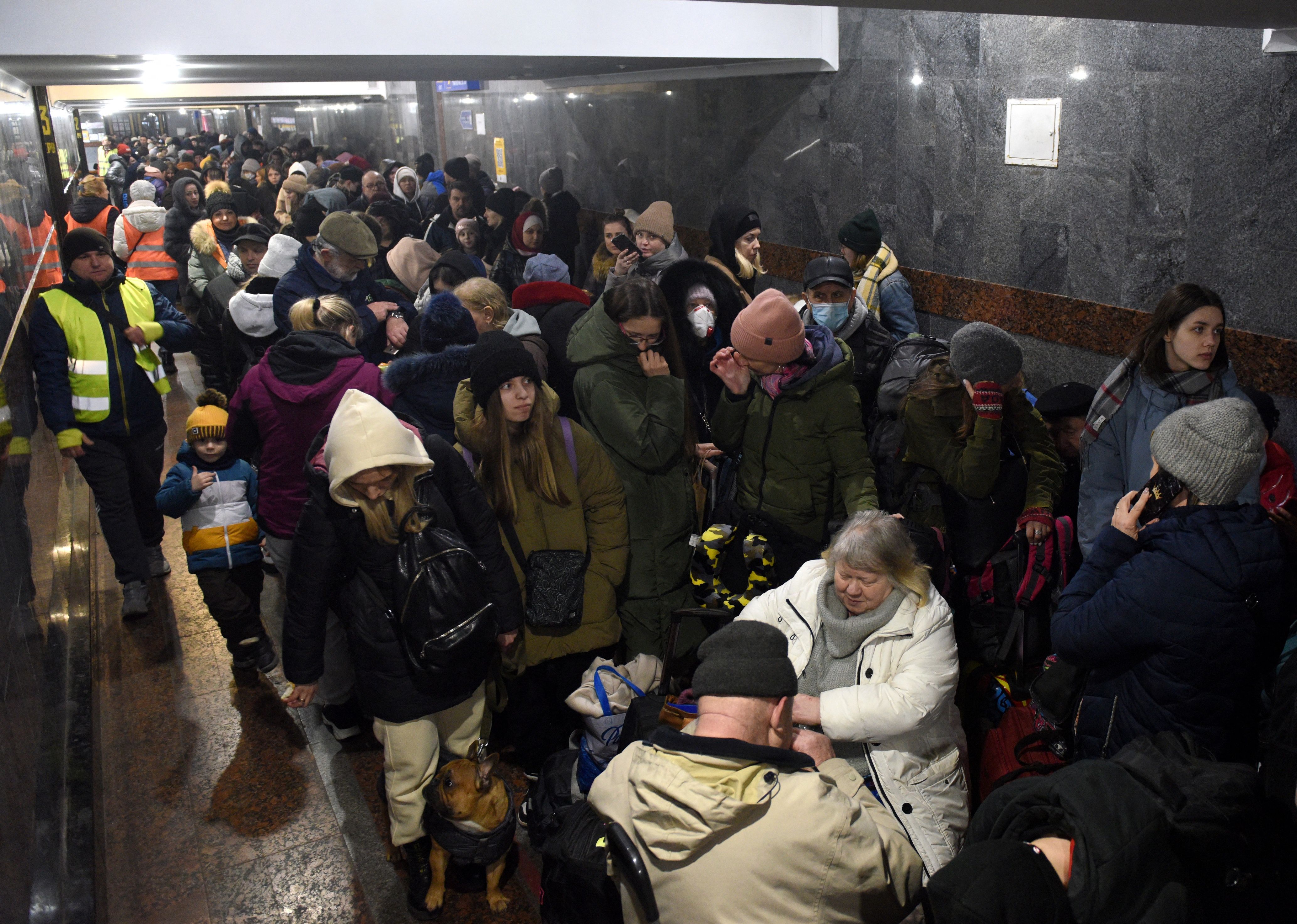  Evacuees from eastern Ukraine wait for a train at the railway station in the western Ukrainian city of Lviv on March 8.