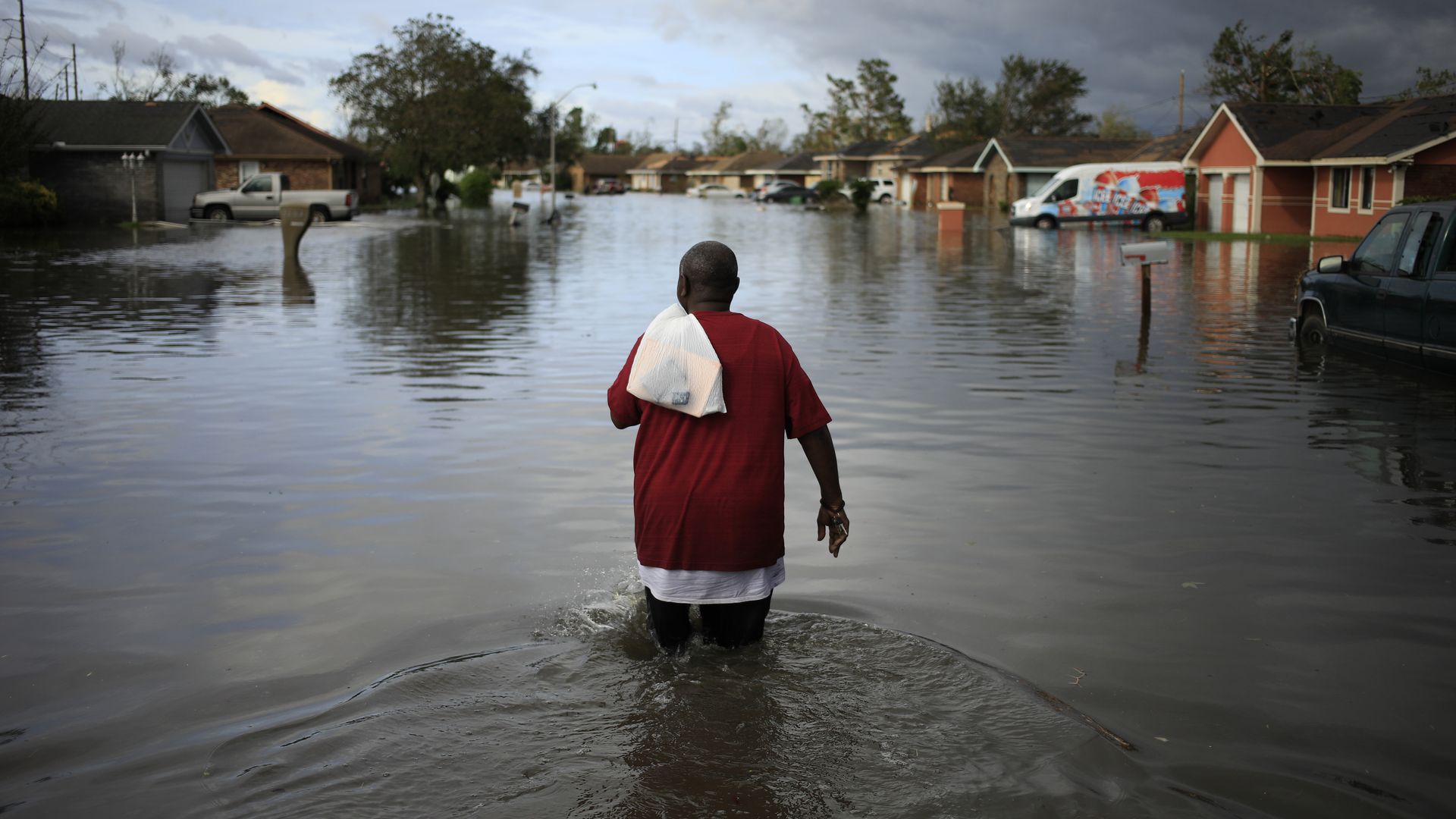 A person walking through floodwater left behind by Hurricane Ida in LaPlace, Louisiana, on Aug. 30.