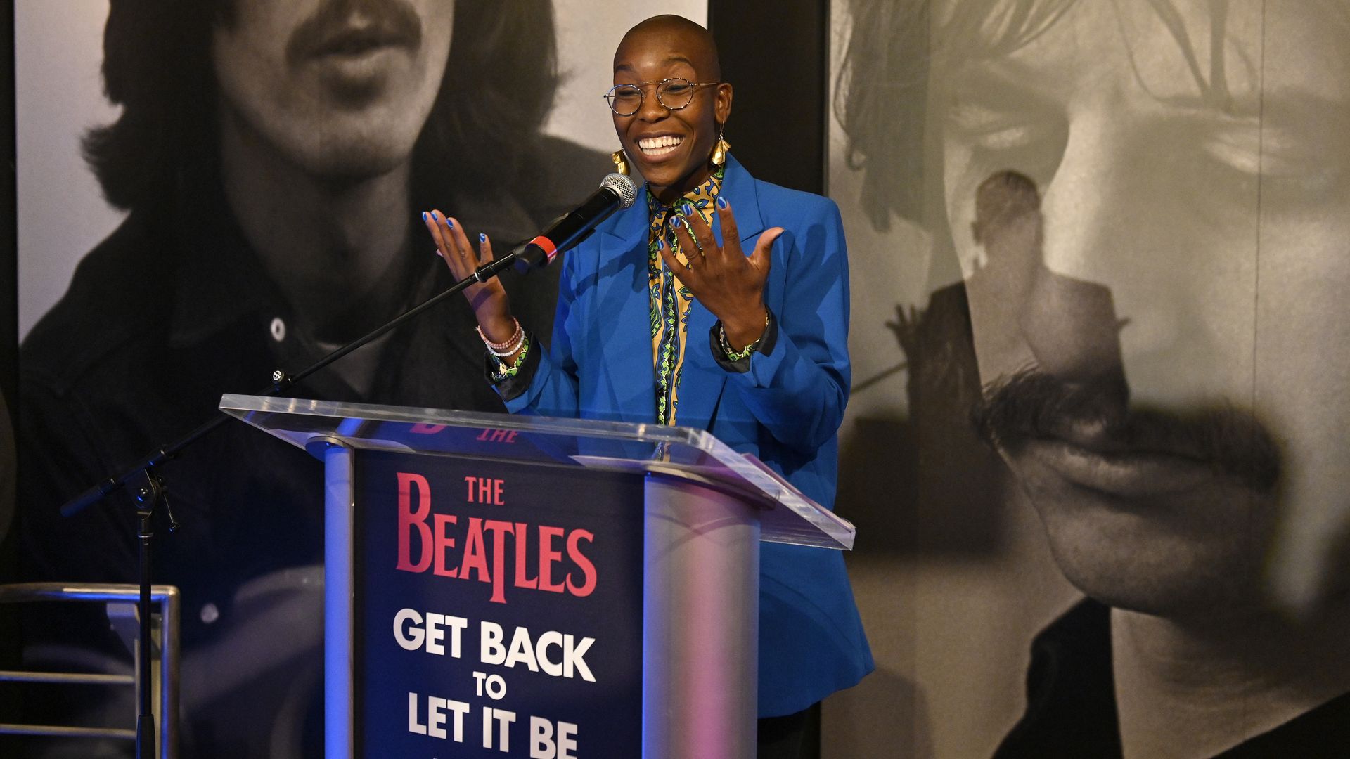 Rock Hall curator Nwaka Onwusa stands at a podium. 