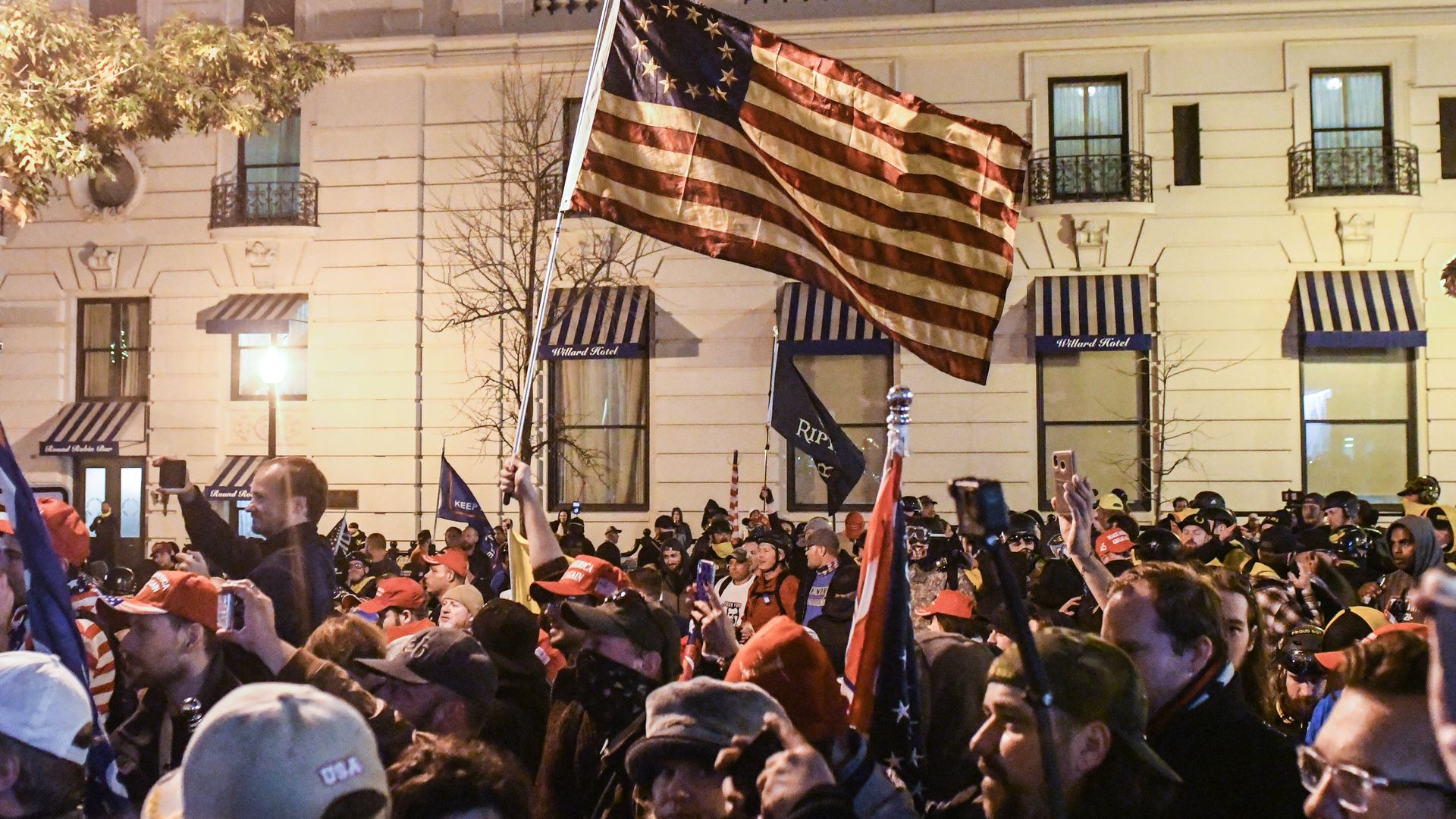  Supporters of President Trump wave a flag during a protest on December 12, 2020 in Washington, DC.