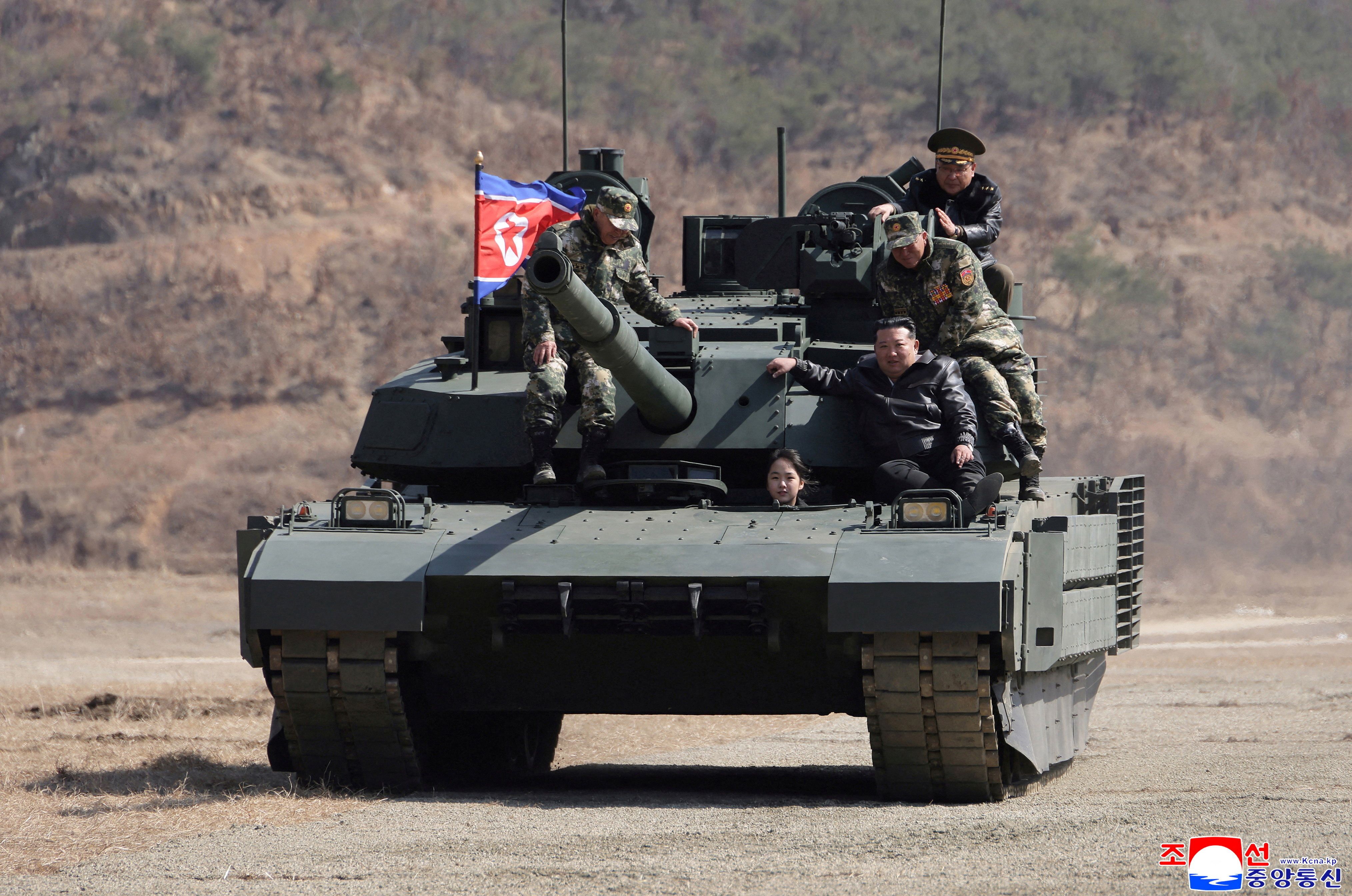 A photo released by North Korean state media shows leader Kim Jong-un and his daughter, Kim Ju-ae, riding a tank at a training base in Pyongyang last month. Photo: Korean Central News Agency via Reuters