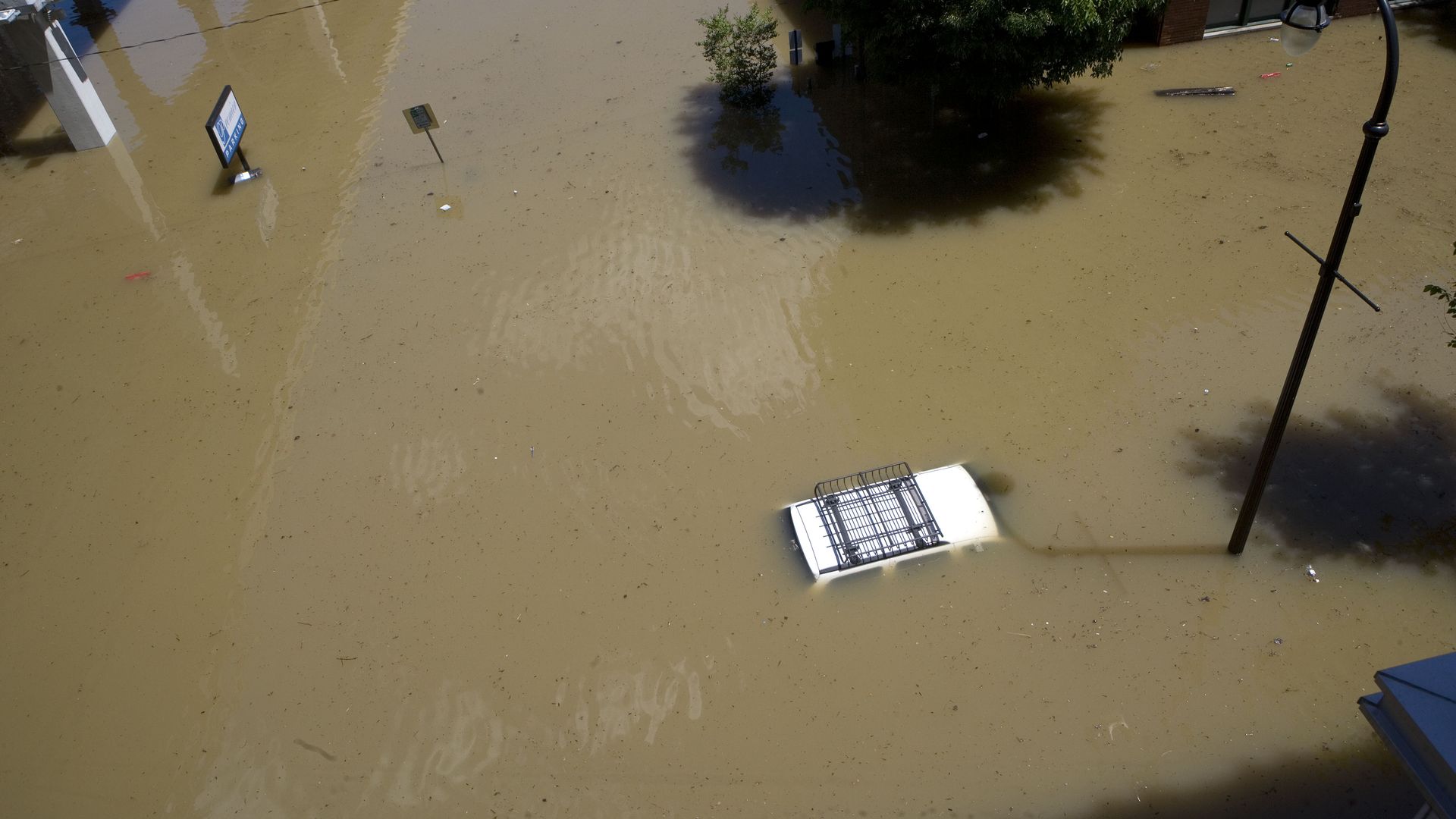 An SUV submerged in flood water