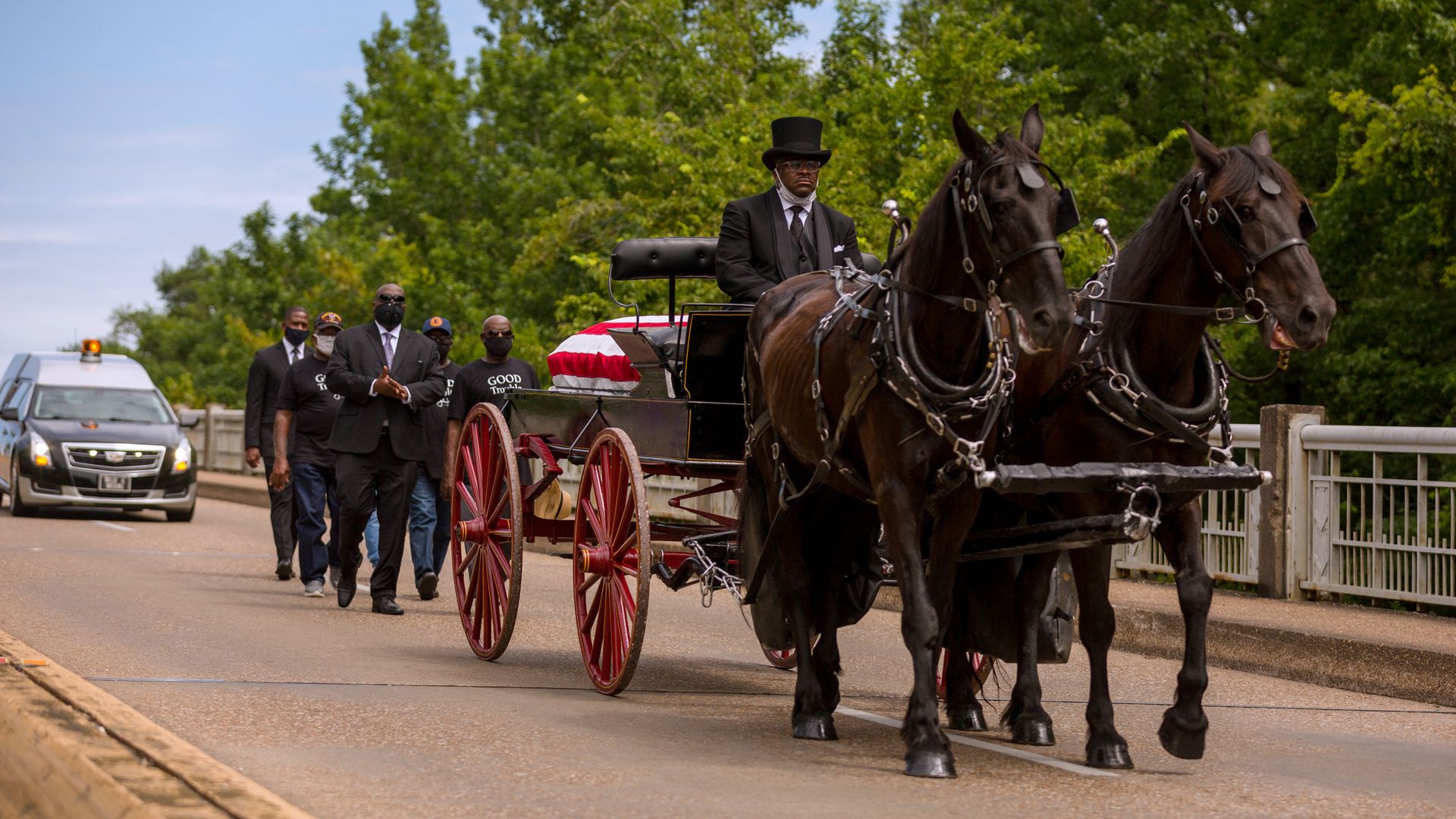 A horse drawn carriage carrying the body of civil rights icon, former US Rep. John Lewis (D-GA) crosses the Edmund Pettus Bridge on July 26, 2020 in Selma, Alabama.
