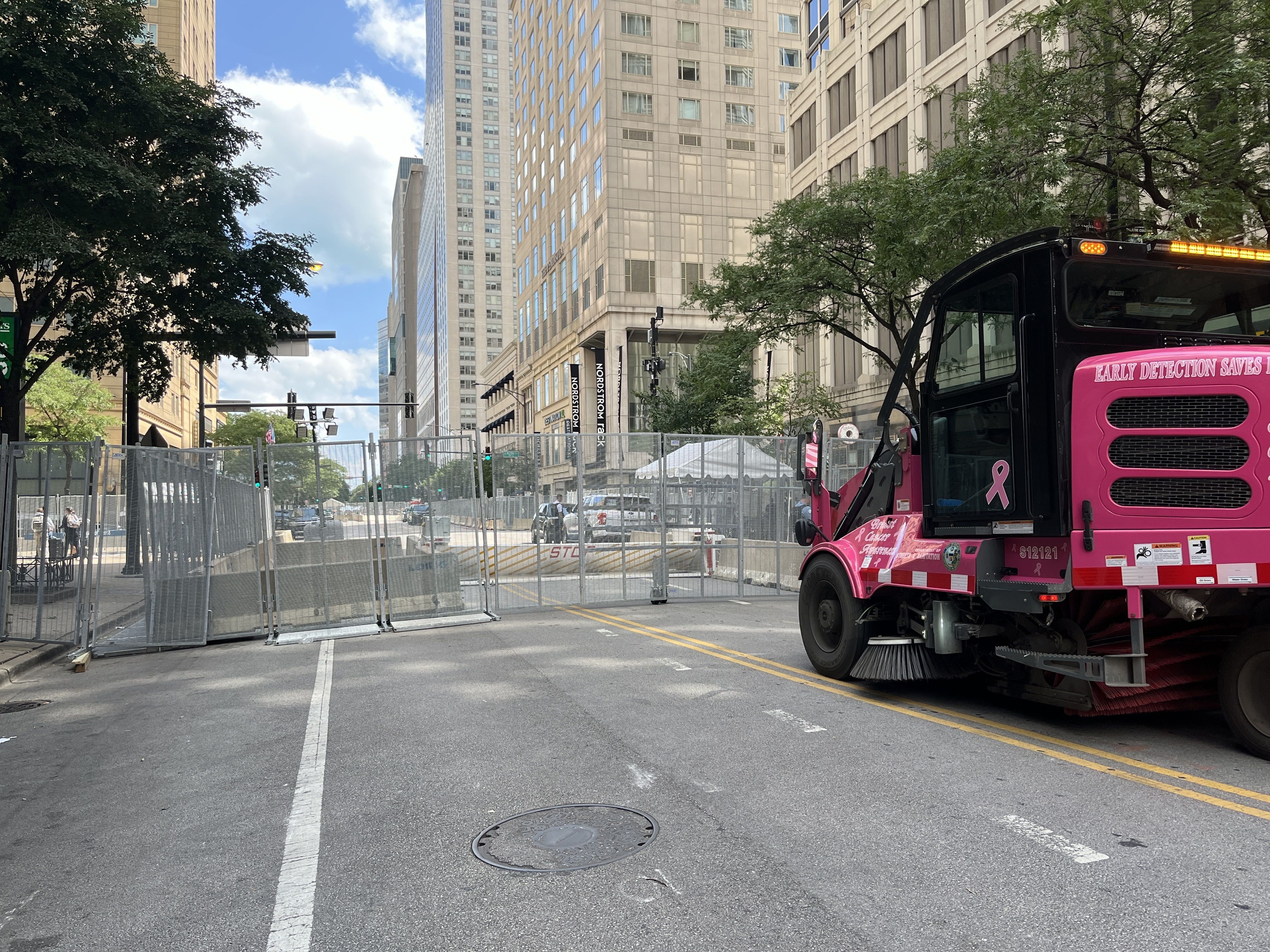 Photo of fences and a truck blocking a street