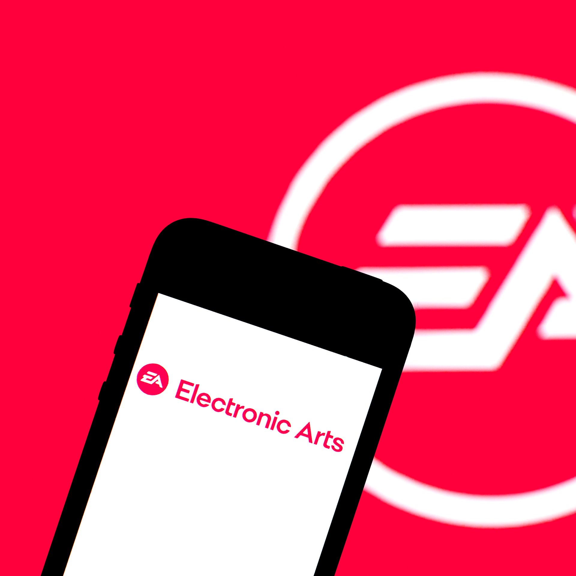 Photo illustration of a cell phone and the EA logo