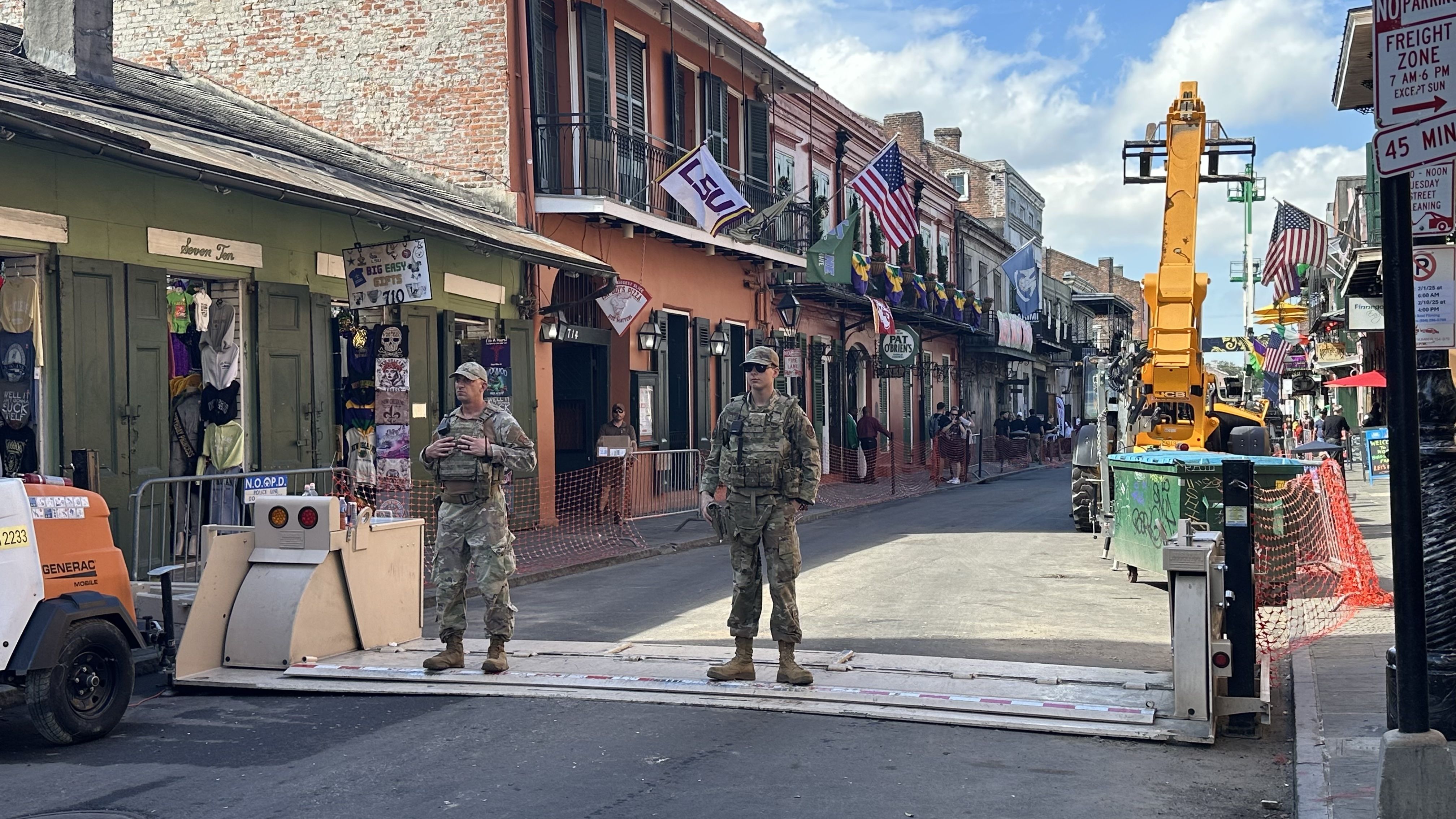 Photo shows soldiers on a vehicle barricade near Bourbon Street.