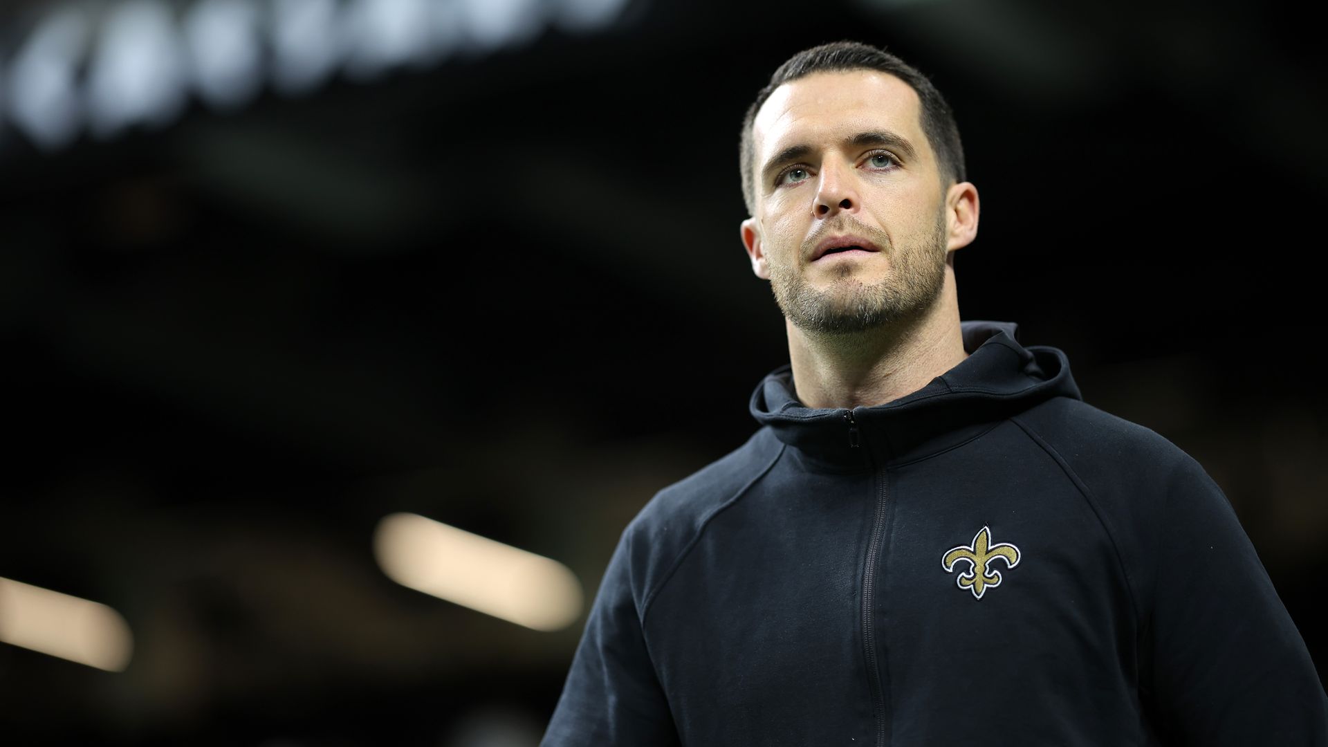 Photo shows Derek Carr in a Saints hoodie.