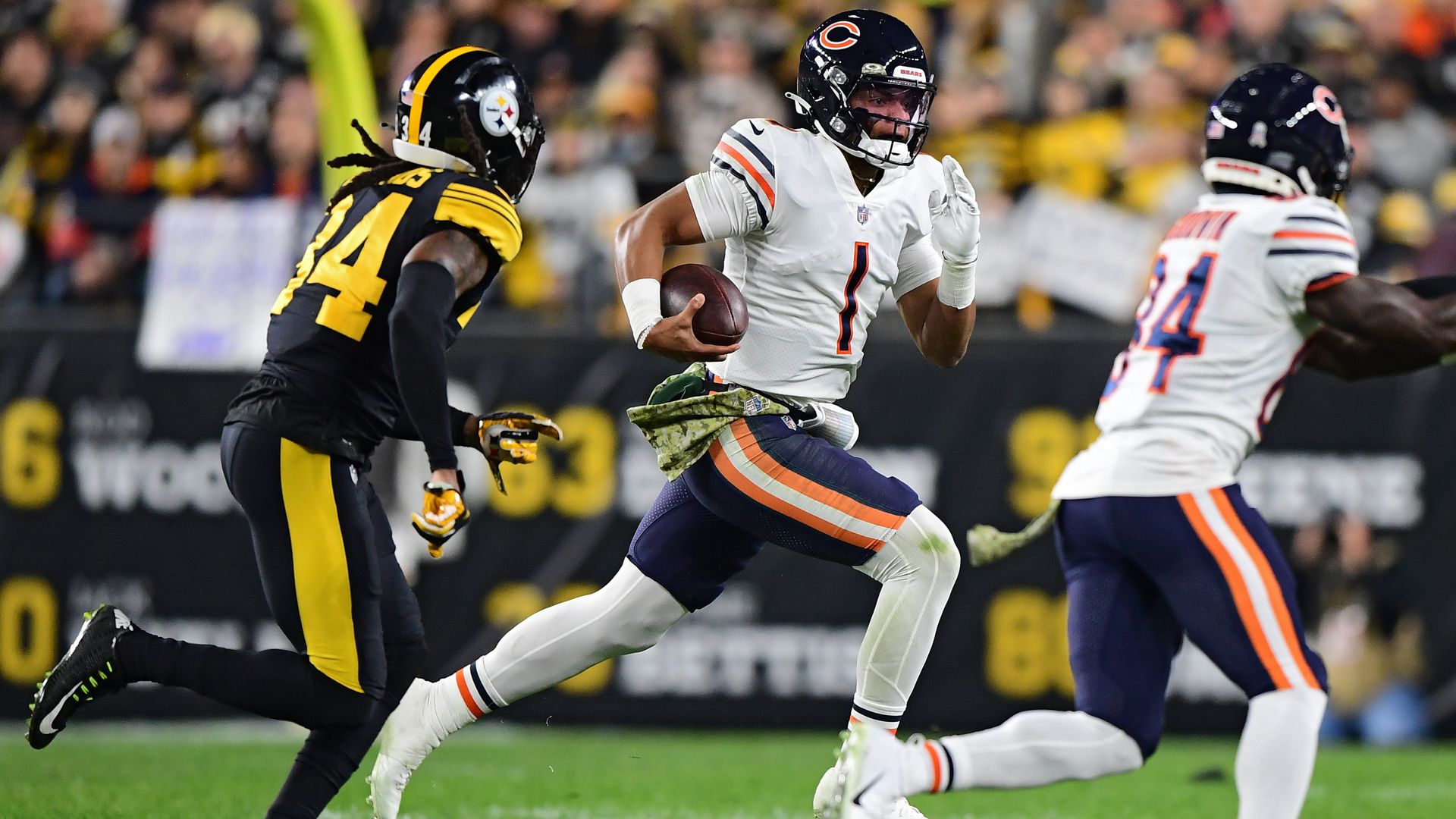 Justin Fields runs against the Pittsburgh Steelers during the first half of Monday Night Football. Photo: Emilee Chinn/Getty Images