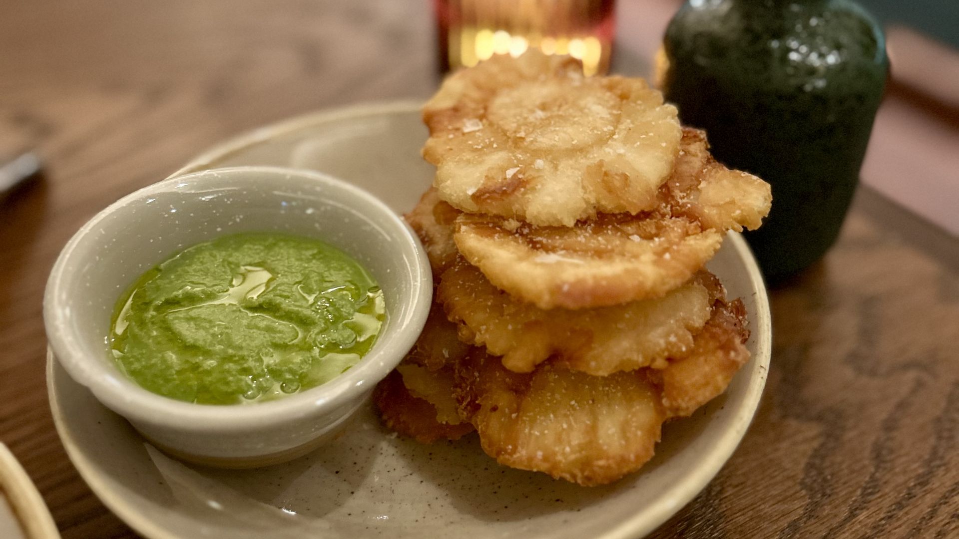 Plate of tostones and dipping sauce. 