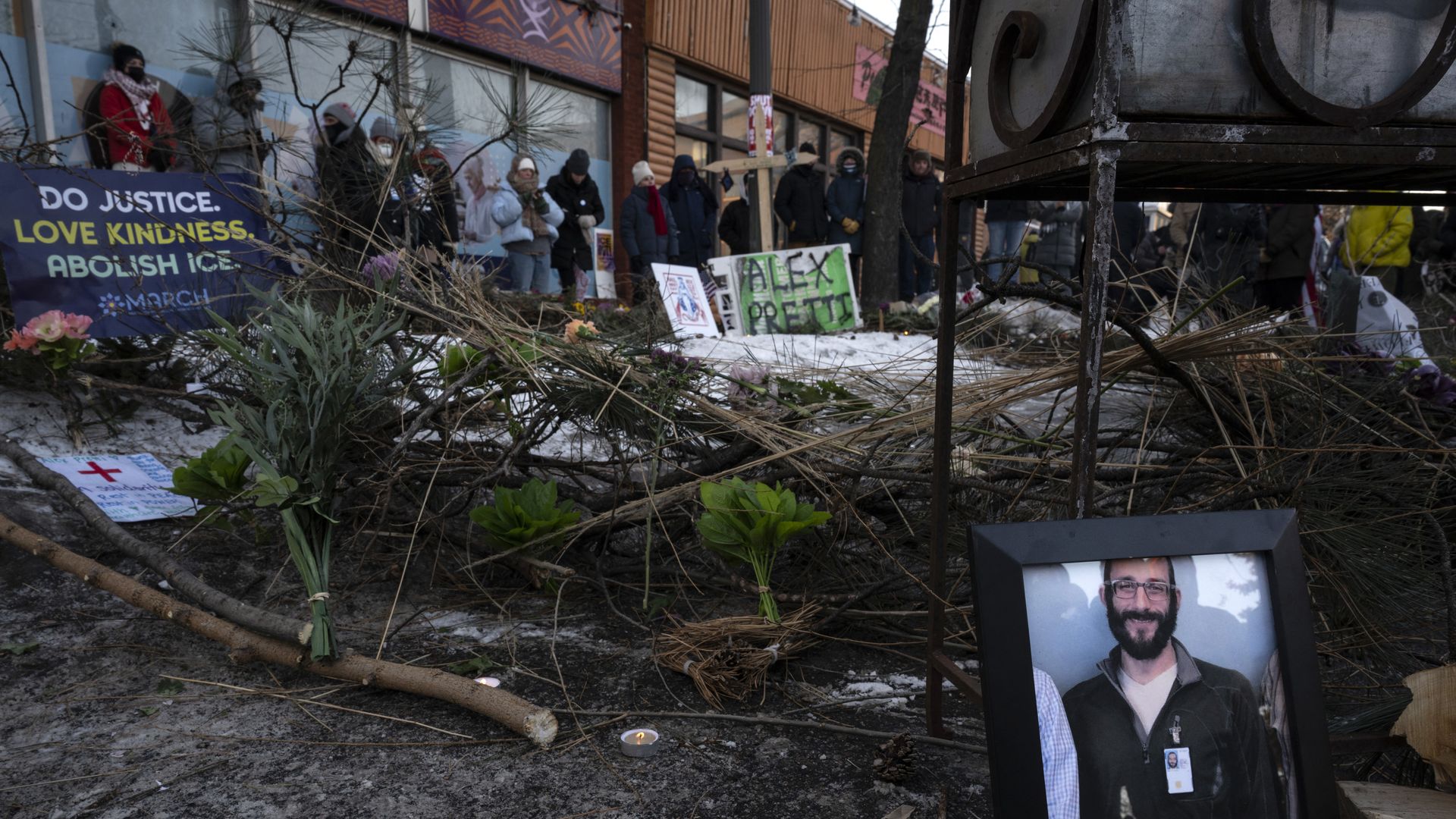 A photo of alex pretti at a makeshift memorial.