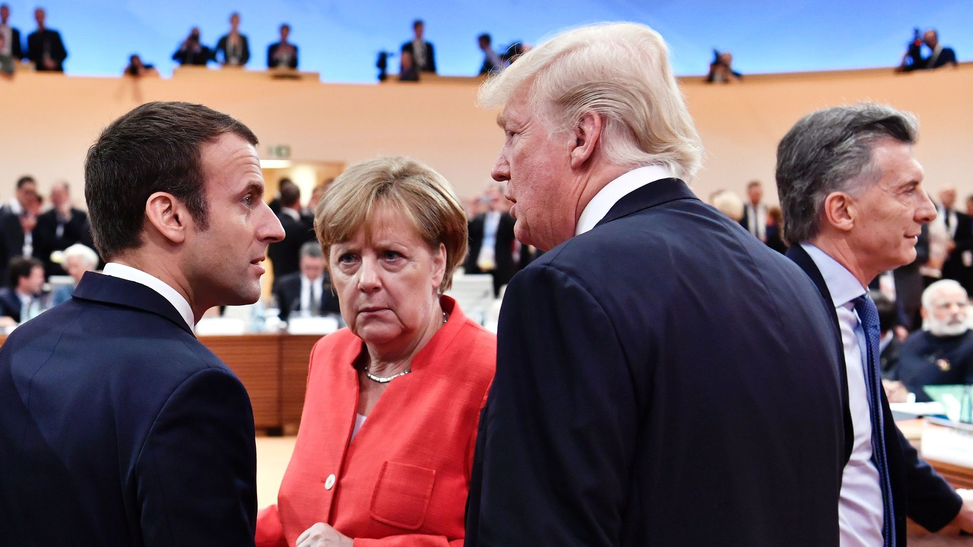 Emmanuel Macron, Angela Merkel, and Donald Trump.