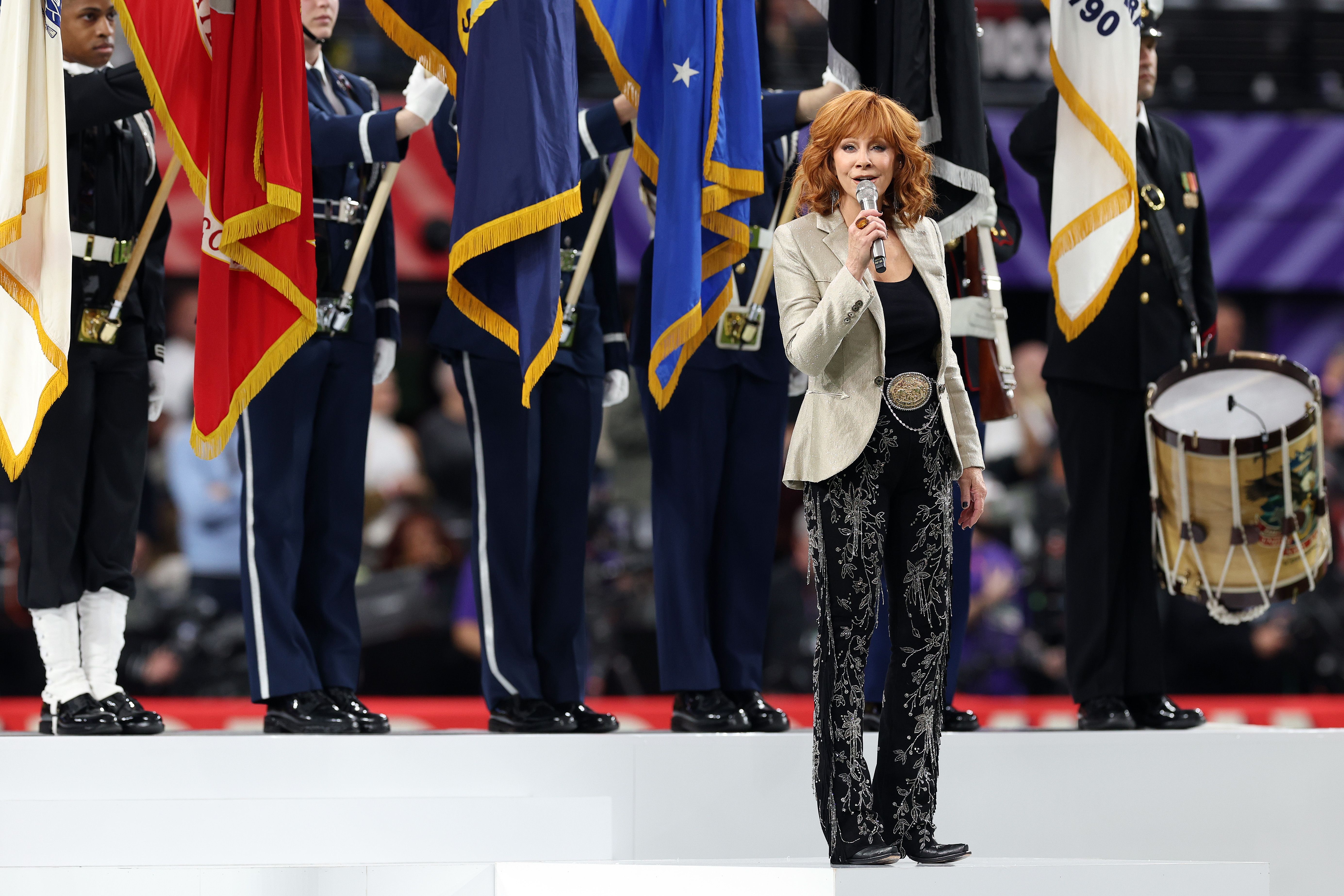 Singer Reba McEntire performs the national anthem prior to Super Bowl LVIII between the San Francisco 49ers and Kansas City Chiefs at Allegiant Stadium on February 11, 2024 in Las Vegas, Nevada. 