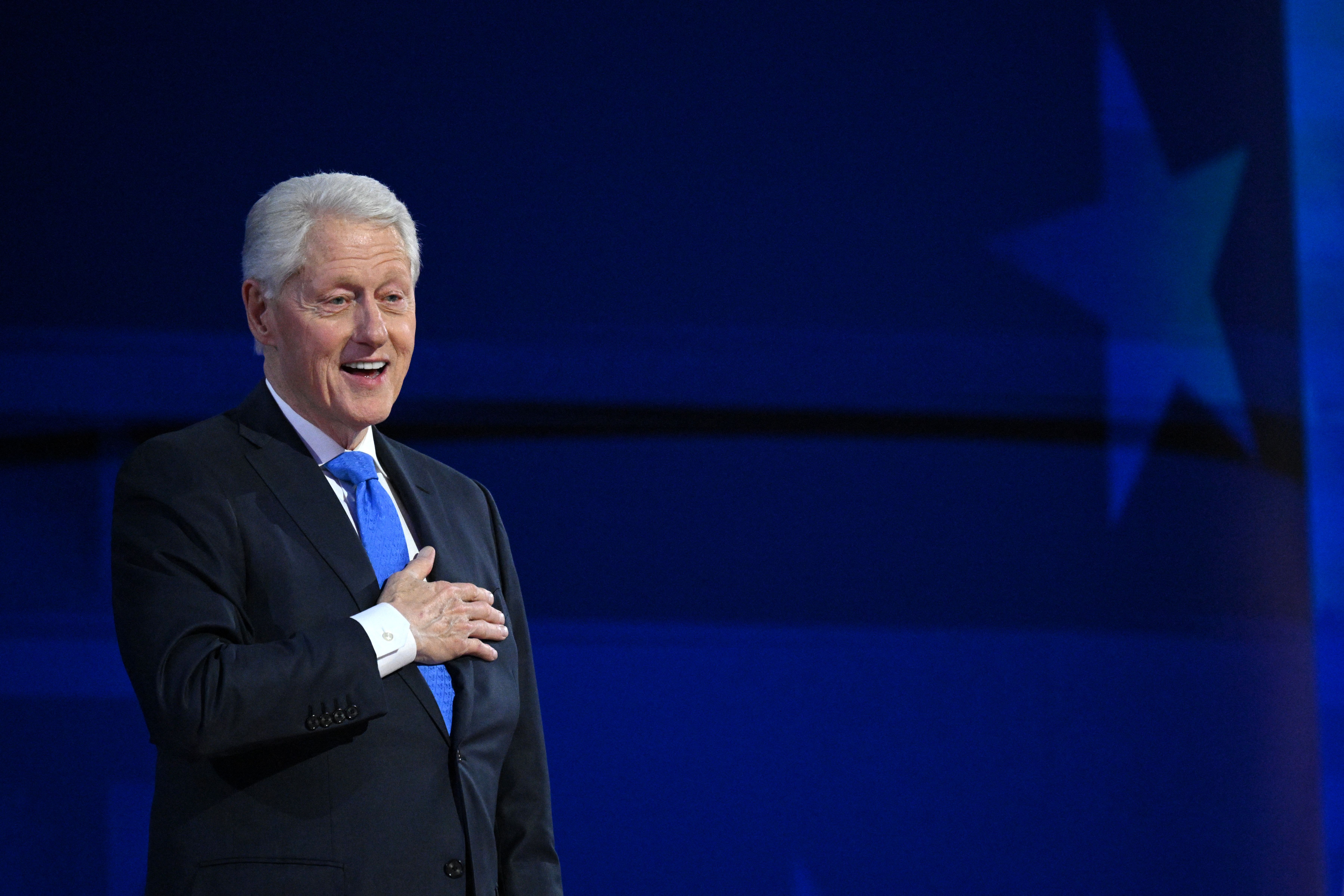 Bill Clinton pats his heart