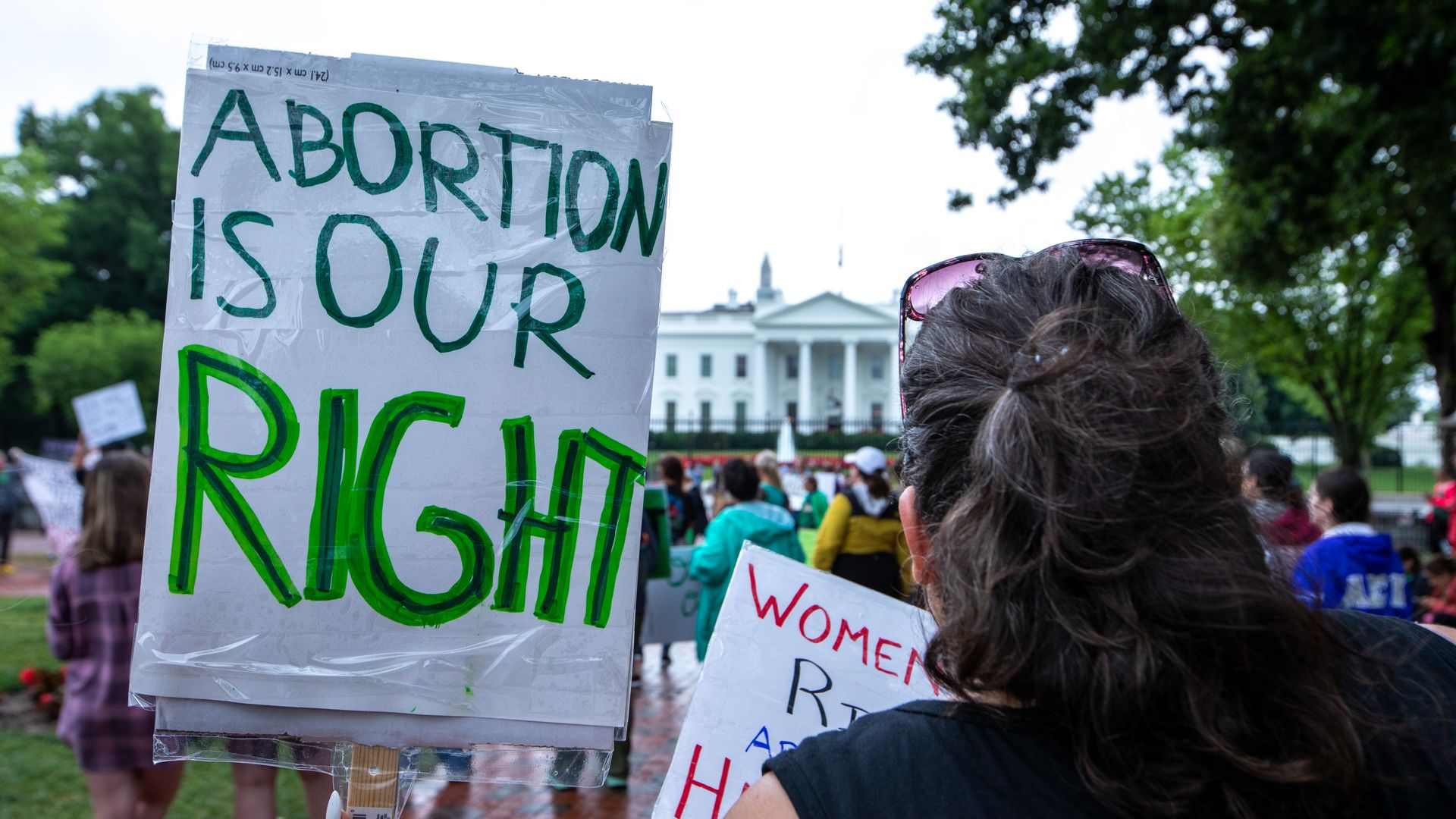 Picture of a green sign that says "abortion is our right"