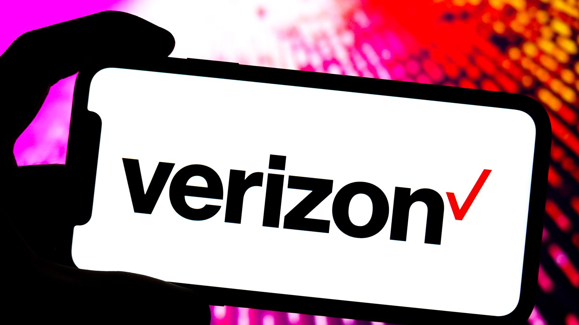 In this photo illustration, a Verizon logo is displayed on the screen of a smartphone. 