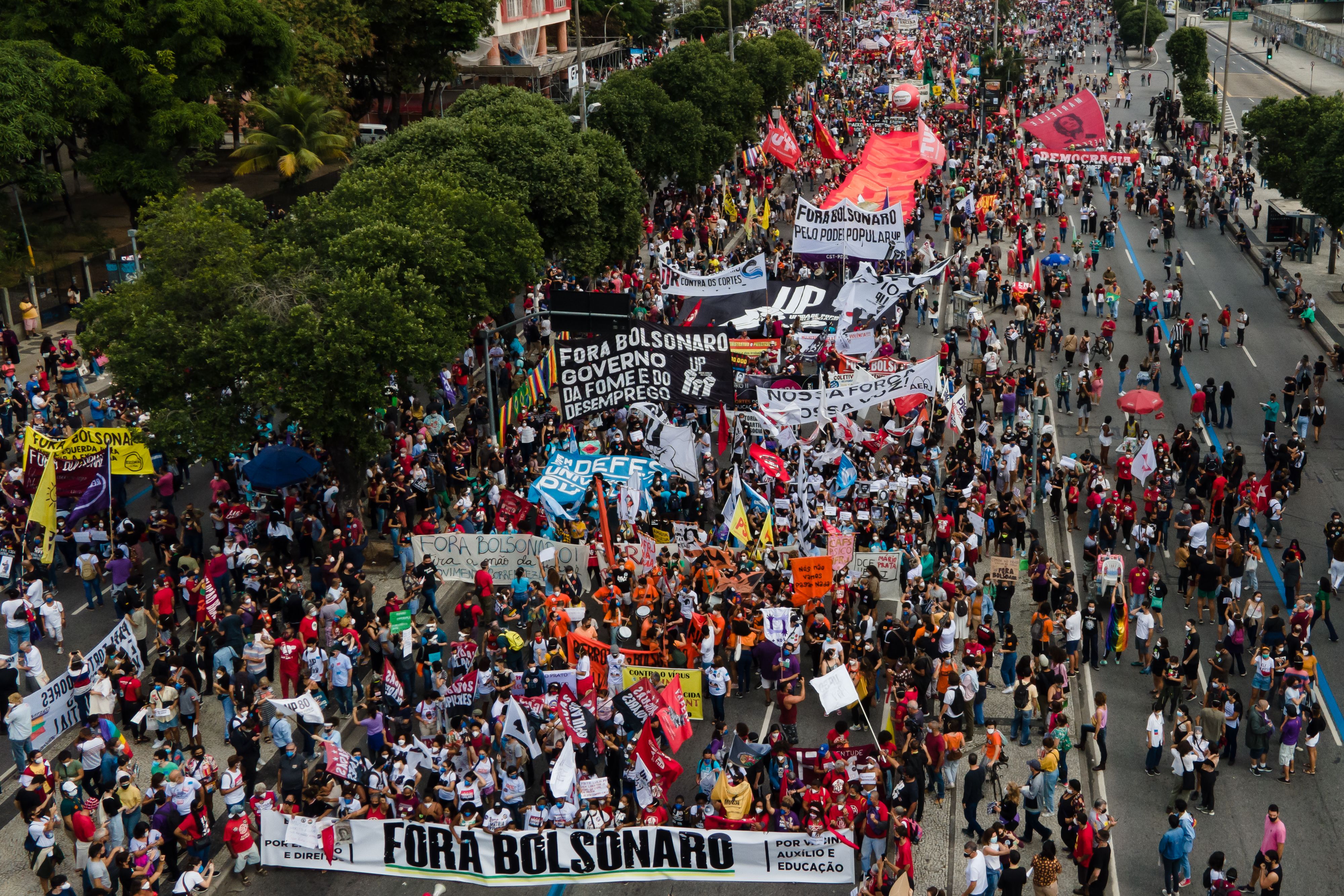 An aerial view as demonstrators hold signs that read 'Bolsonaro out' during a protest against Bolsonaro's administration on June 19, 2021 in Rio de Janeiro, Brazil. 