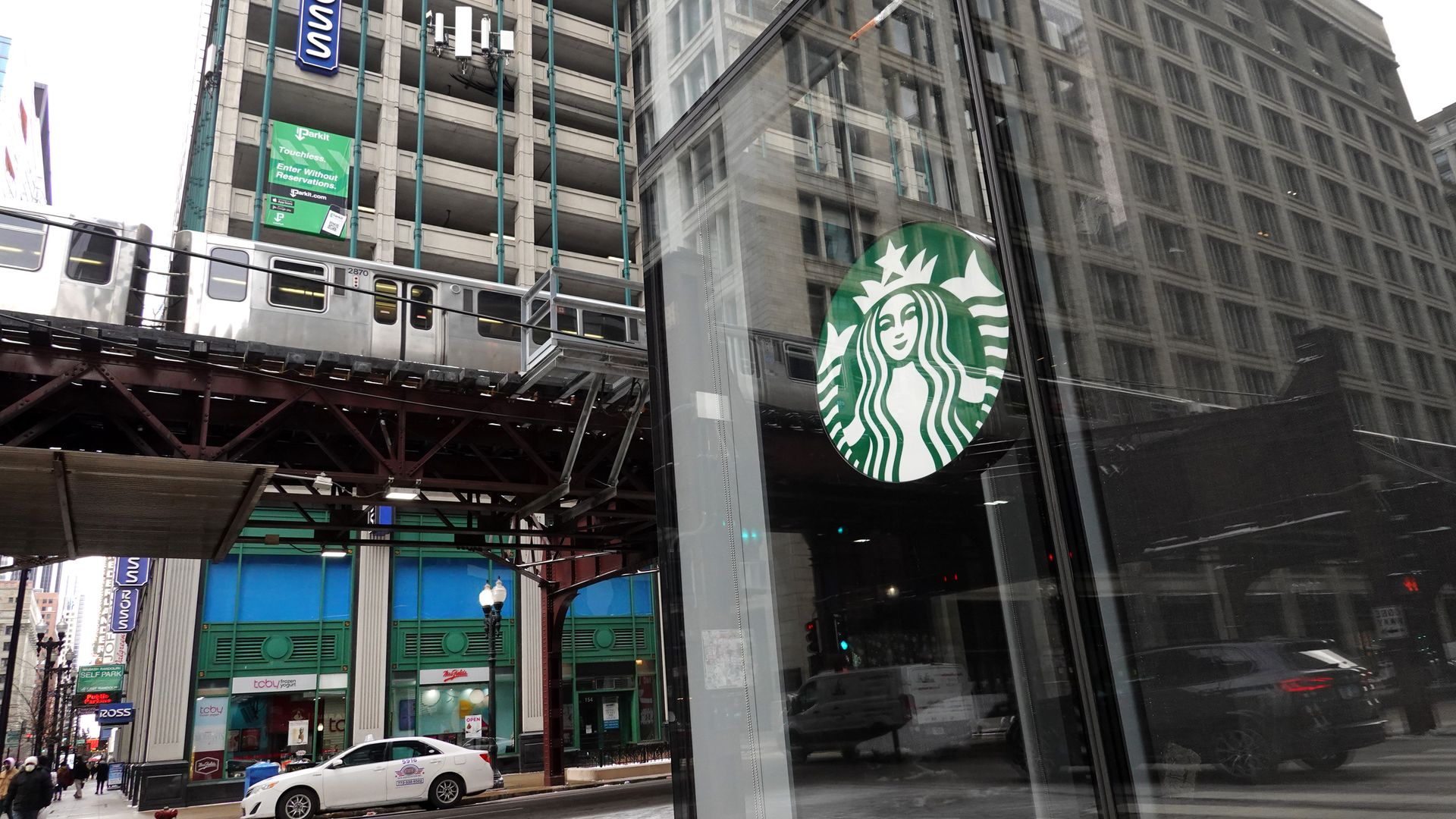 Photo of the front of a Starbucks coffee shop.