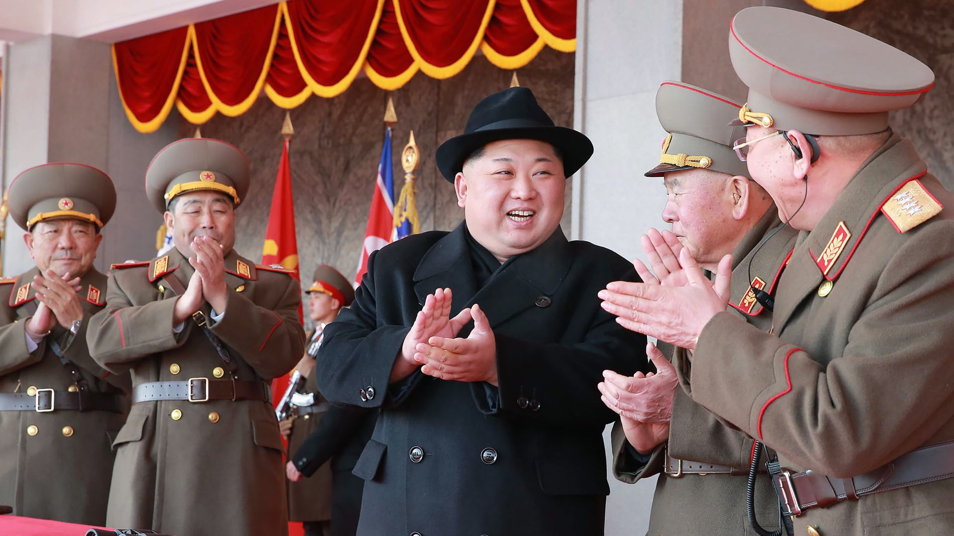 Kim Jong-un and military leaders at parade