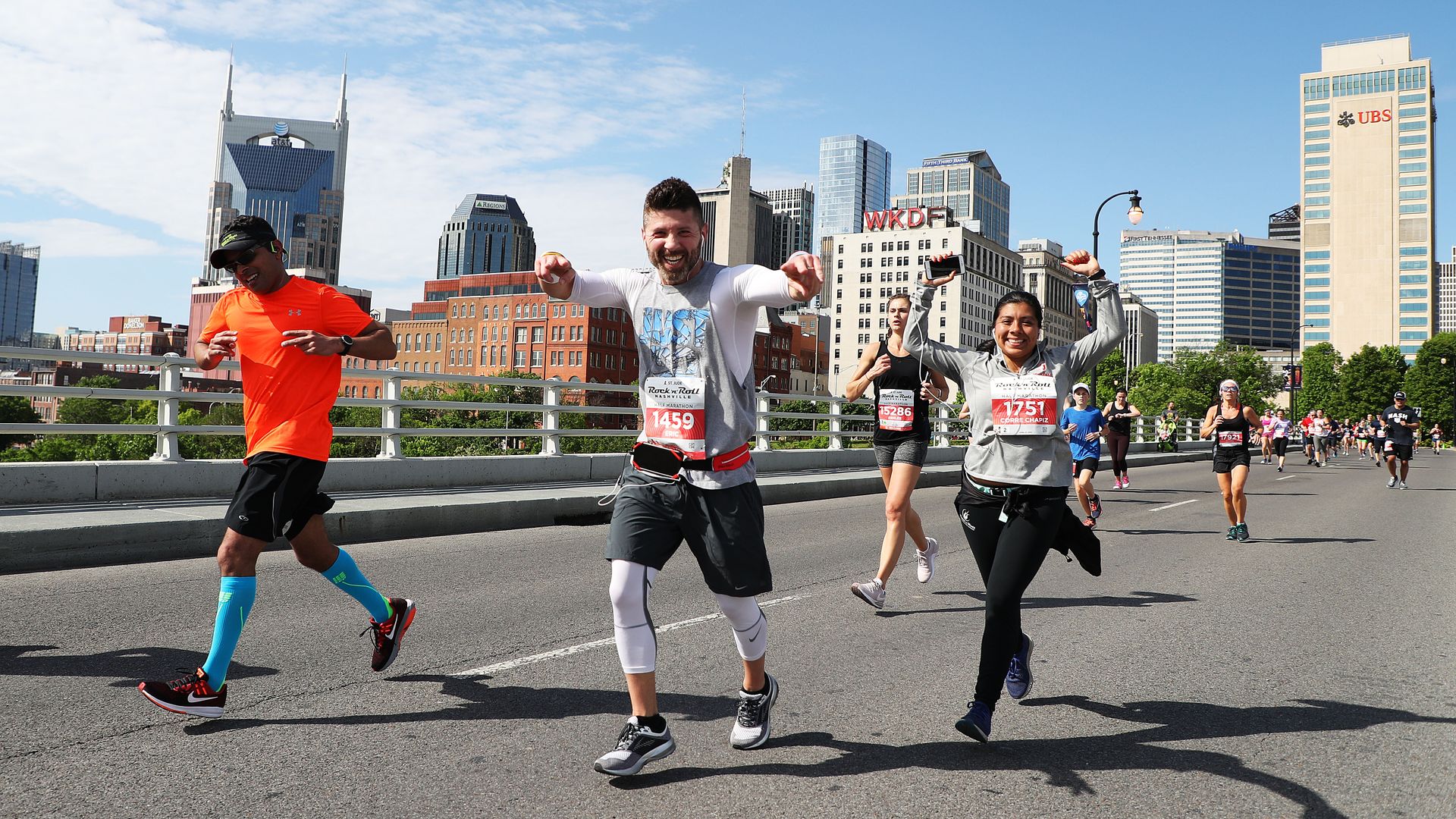 Competitors run past the Nashville skyline during the St. Jude Rock 'n' Roll Nashville Marathon 1/2 Marathon on April 27, 2019 in Nashville, Tennessee.
