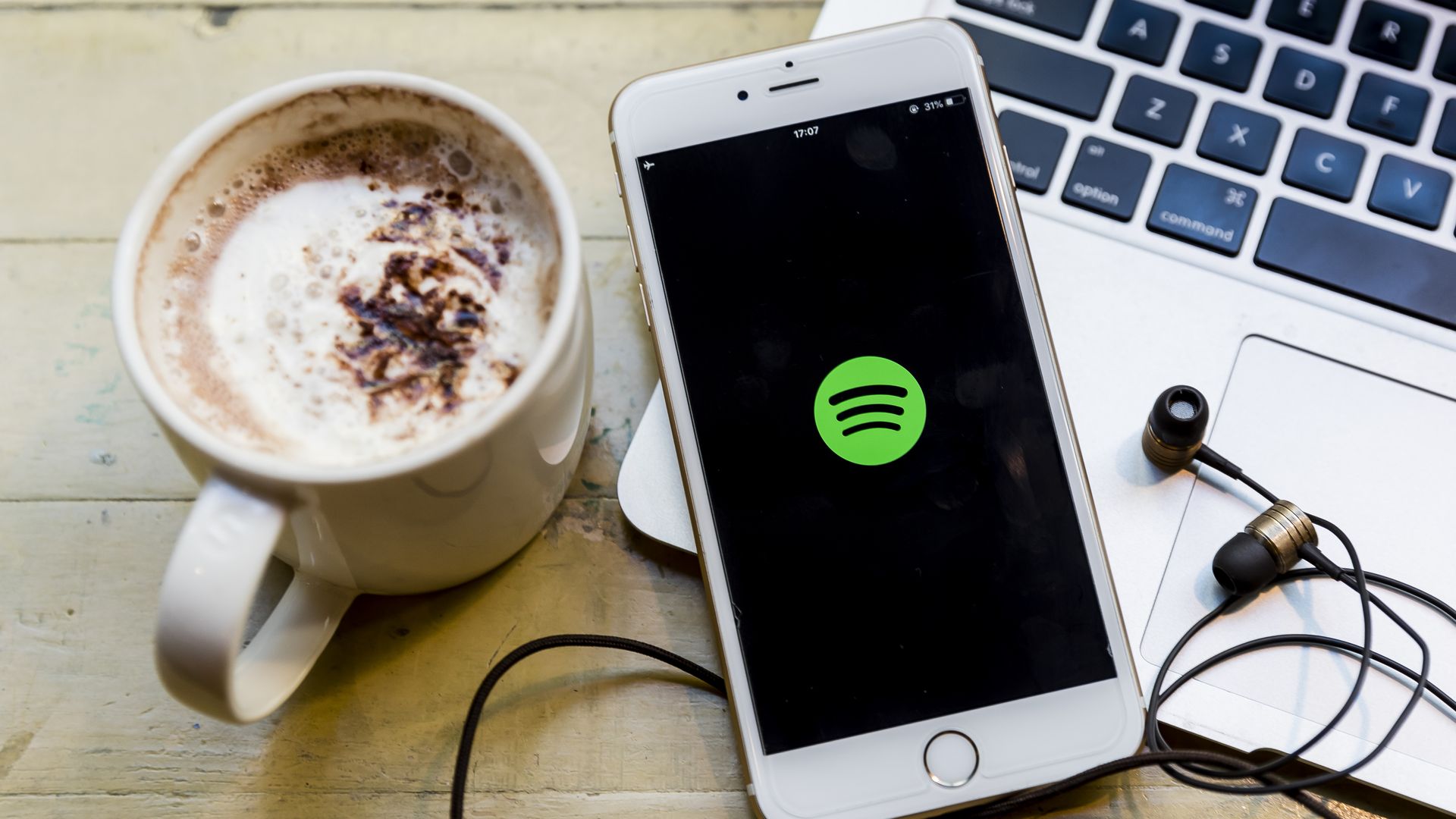 A phone with the spotify logo on it.