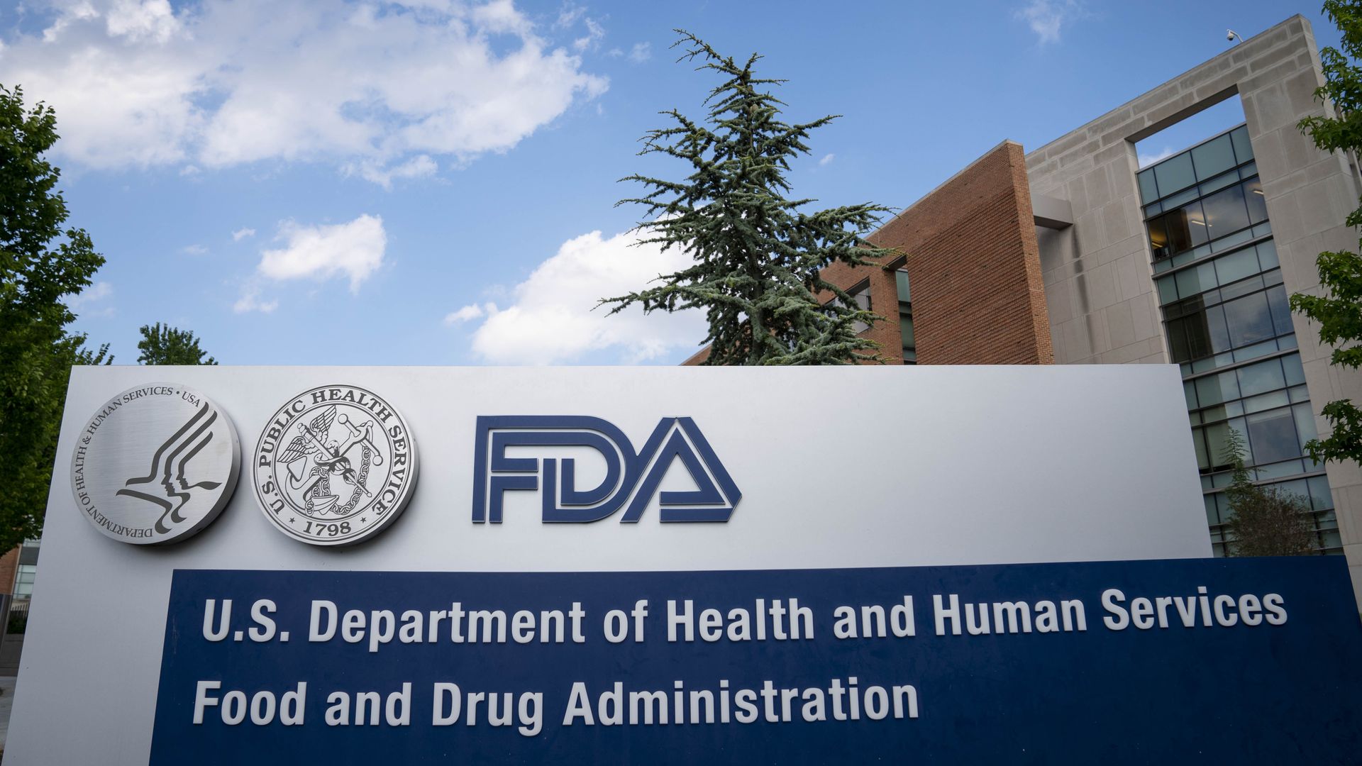 The blue and white FDA sign outside of its headquarters building.