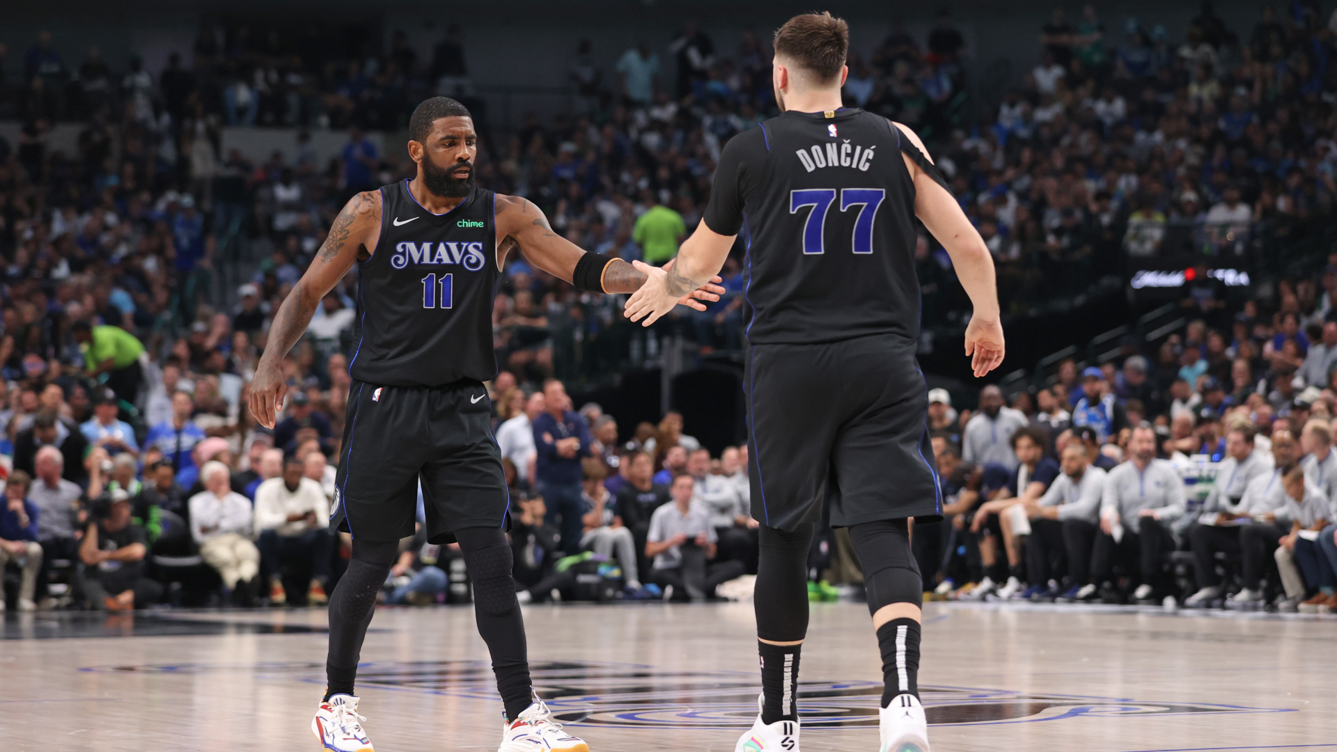 Luka Doncic and Kyrie Irving high five 