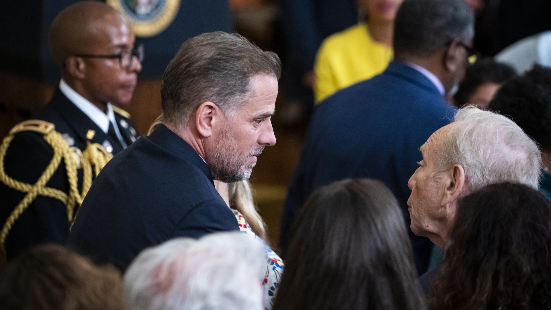 Hunter Biden, son of President Biden, speaking to former Senator Joe Lieberman during a White House ceremony in July 2022.