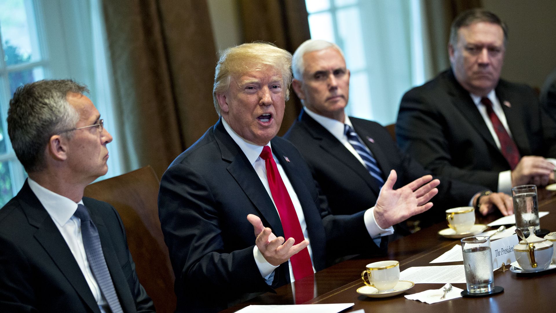 U.S. President Donald Trump speaks as Mike Pence, Mike Pompeo, and Jens Stoltenberg, secretary general of NATO, listen during a meeting in the Cabinet Room of the White House on May 17, 2018.