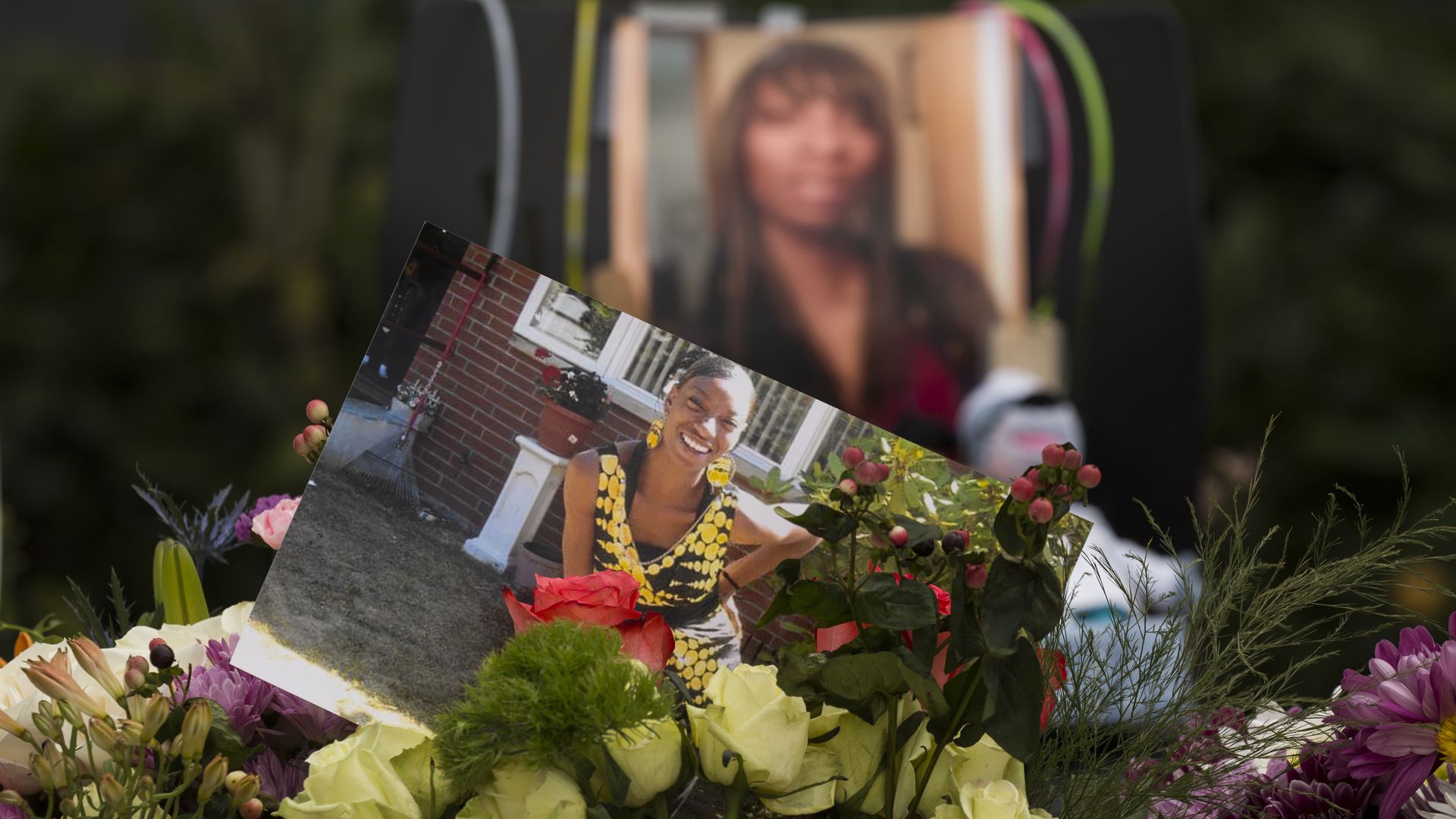 A memorial shrine with flowers, photos, and other items were placed outside the apartment where Charleena Lyles was killed by Seattle police officers in June 2017. 